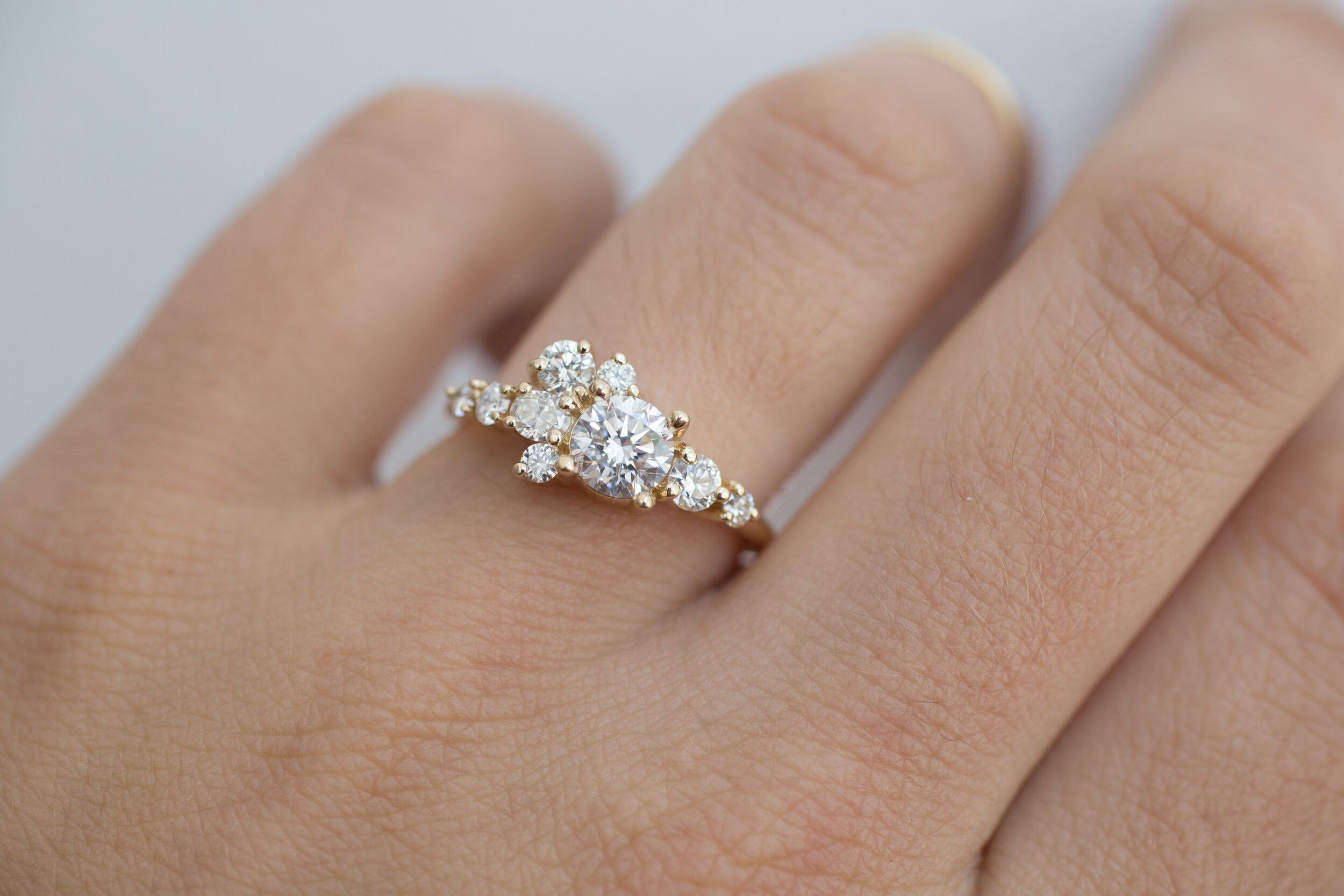 Ilia Ring | Round Brilliant Cut Diamond + Diamond Cluster Engagement Ring 0.70 ct | 14k Recycled Gold