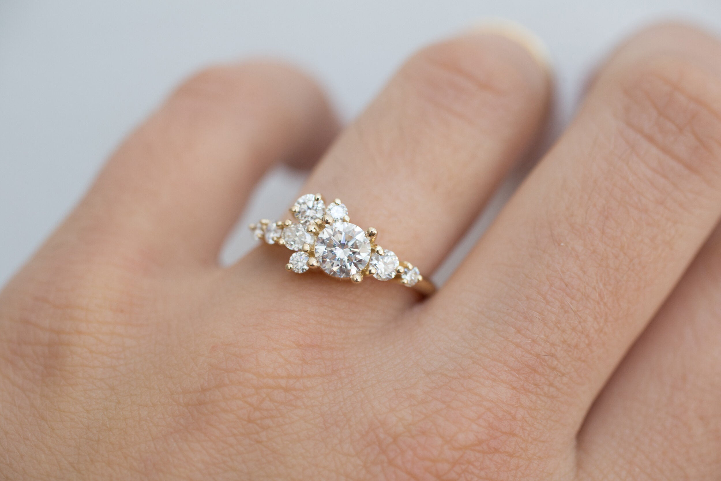Ilia Ring | Round Brilliant Cut Diamond + Diamond Cluster Engagement Ring 0.70 ct | 14k Recycled Gold
