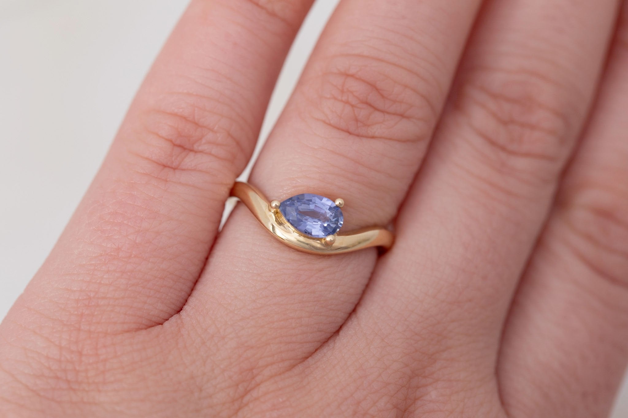Rhodes Ring | Periwinkle Pear Sapphire Solitaire + Curved Band Engagement Ring 0.81 ct | 14k Recycled Gold | One of a Kind