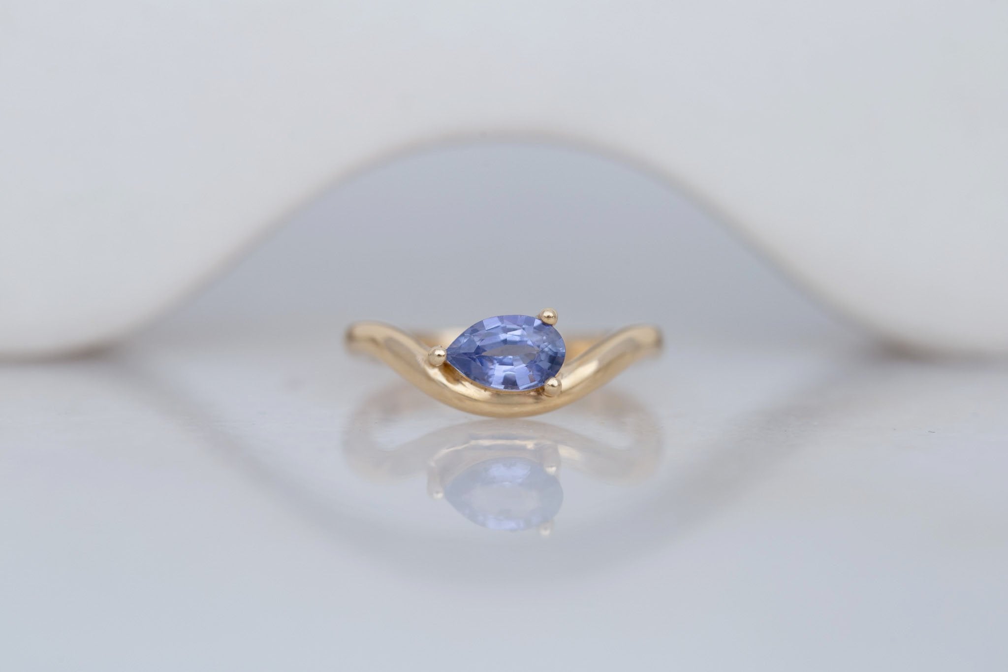 Rhodes Ring | Periwinkle Pear Sapphire Solitaire + Curved Band Engagement Ring 0.81 ct | 14k Recycled Gold | One of a Kind