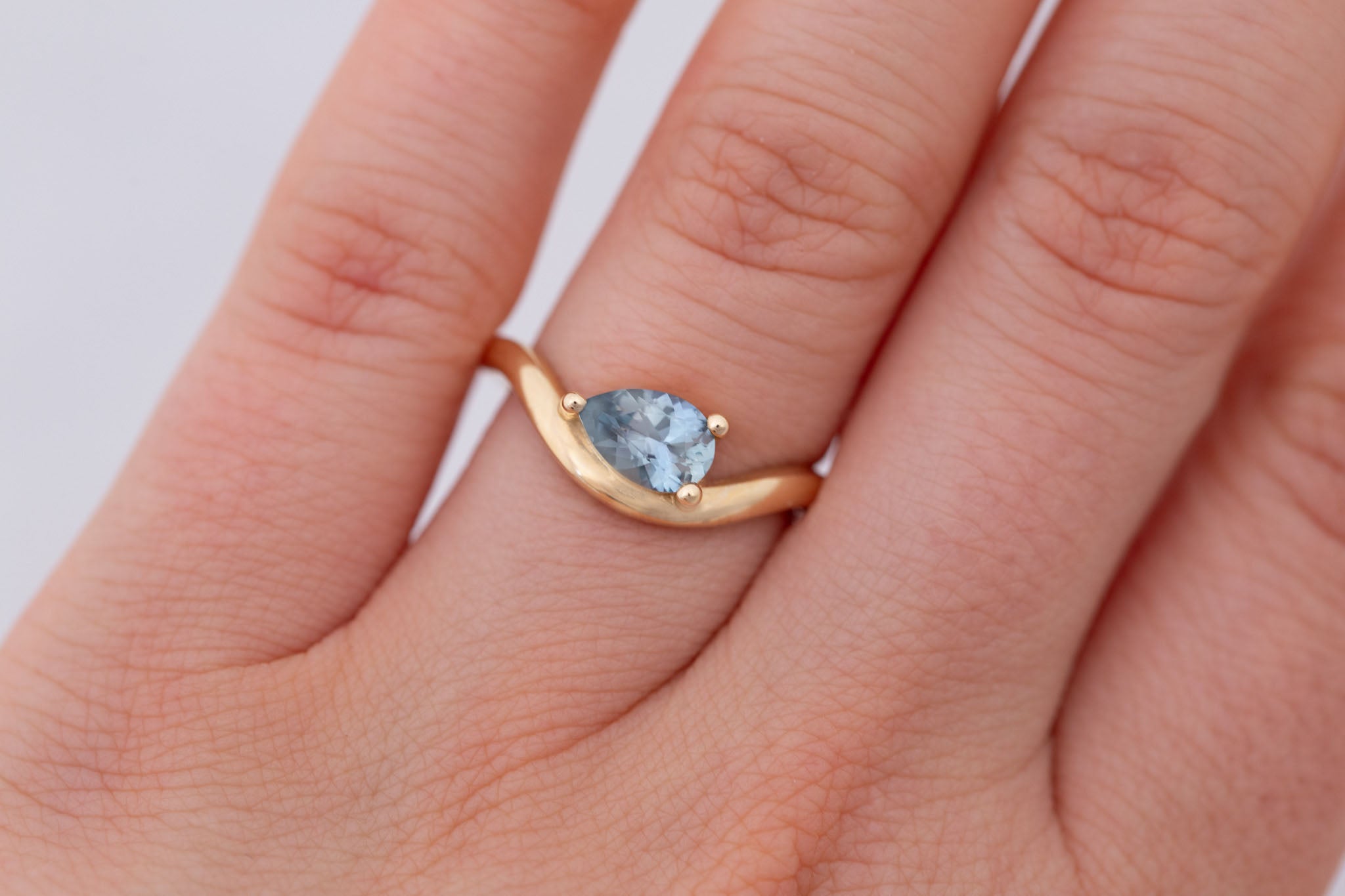 Rhodes Ring | Blue Montana Pear Cut Sapphire Solitaire + Curved Band Engagement Ring 0.88 ct | 14k Recycled Gold | One of a Kind