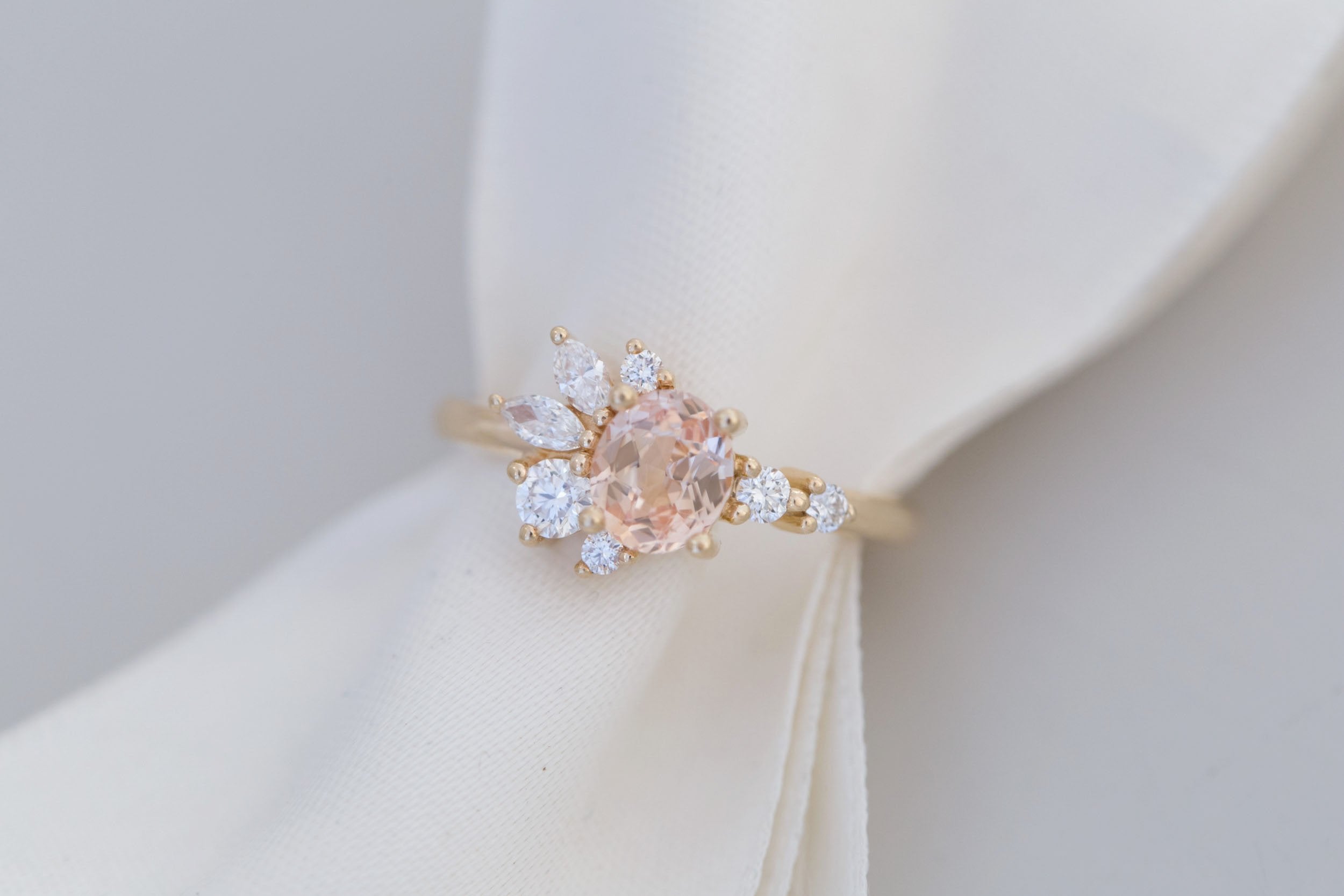 Ambretta Ring | Peach Oval Sapphire + Diamond Cluster Engagement Ring 0.96 ct | 14k Recycled Gold | One of a Kind