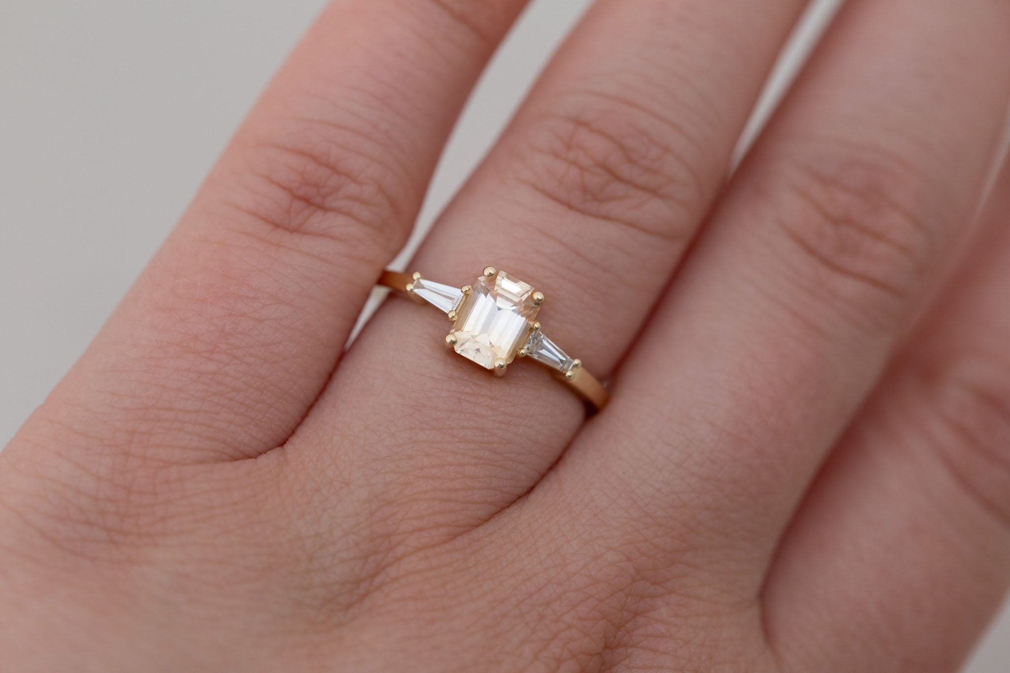 Marlowe Ring | Apricot Emerald Cut Sapphire + Tapered Baguette Engagement Ring 1.08 ct | 14k Recycled Gold | One of a Kind
