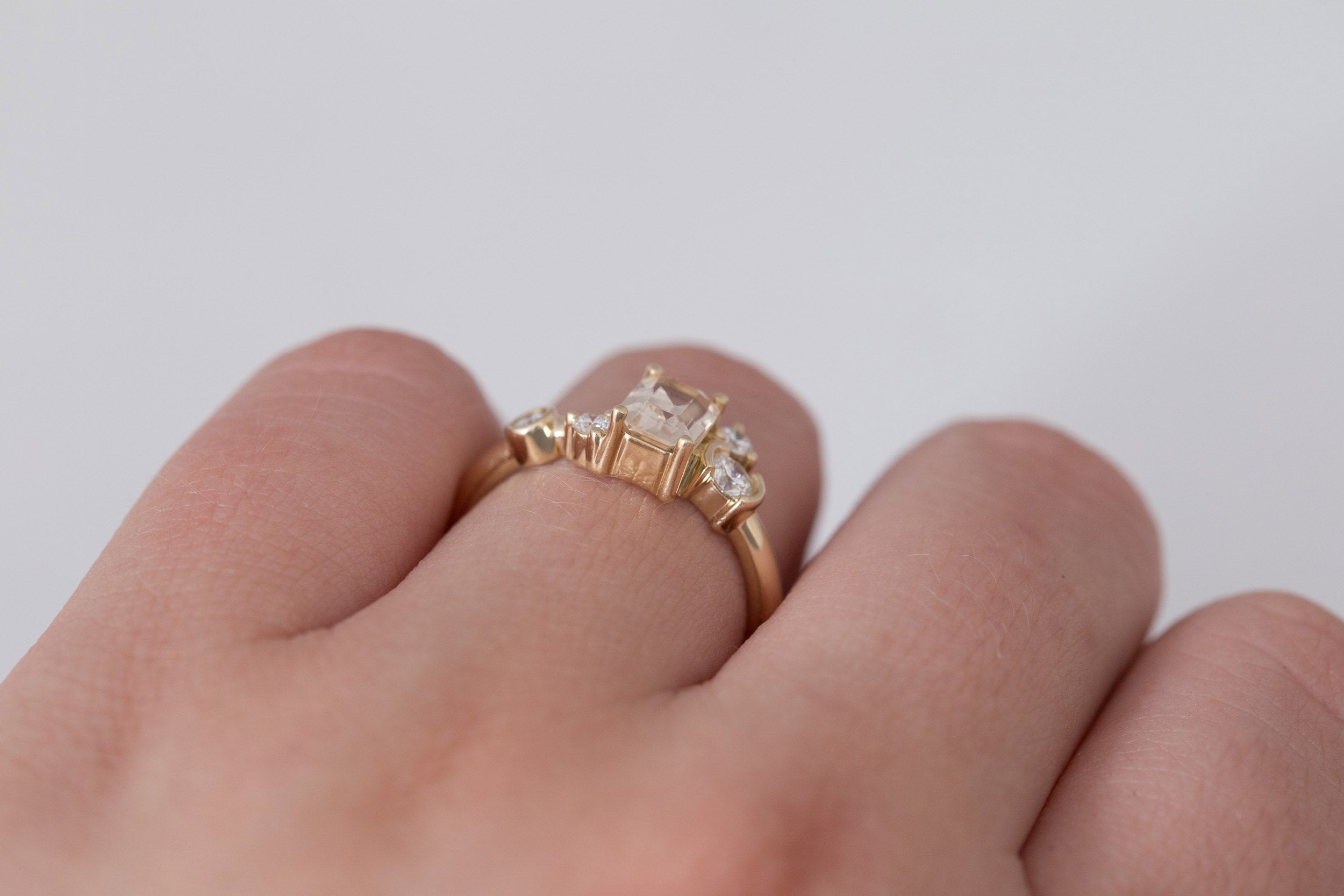 Mae Ring | Emerald Cut Apricot Sapphire + Diamond Cluster Ring 1.09 | 14k Recycled Gold | One of a Kind