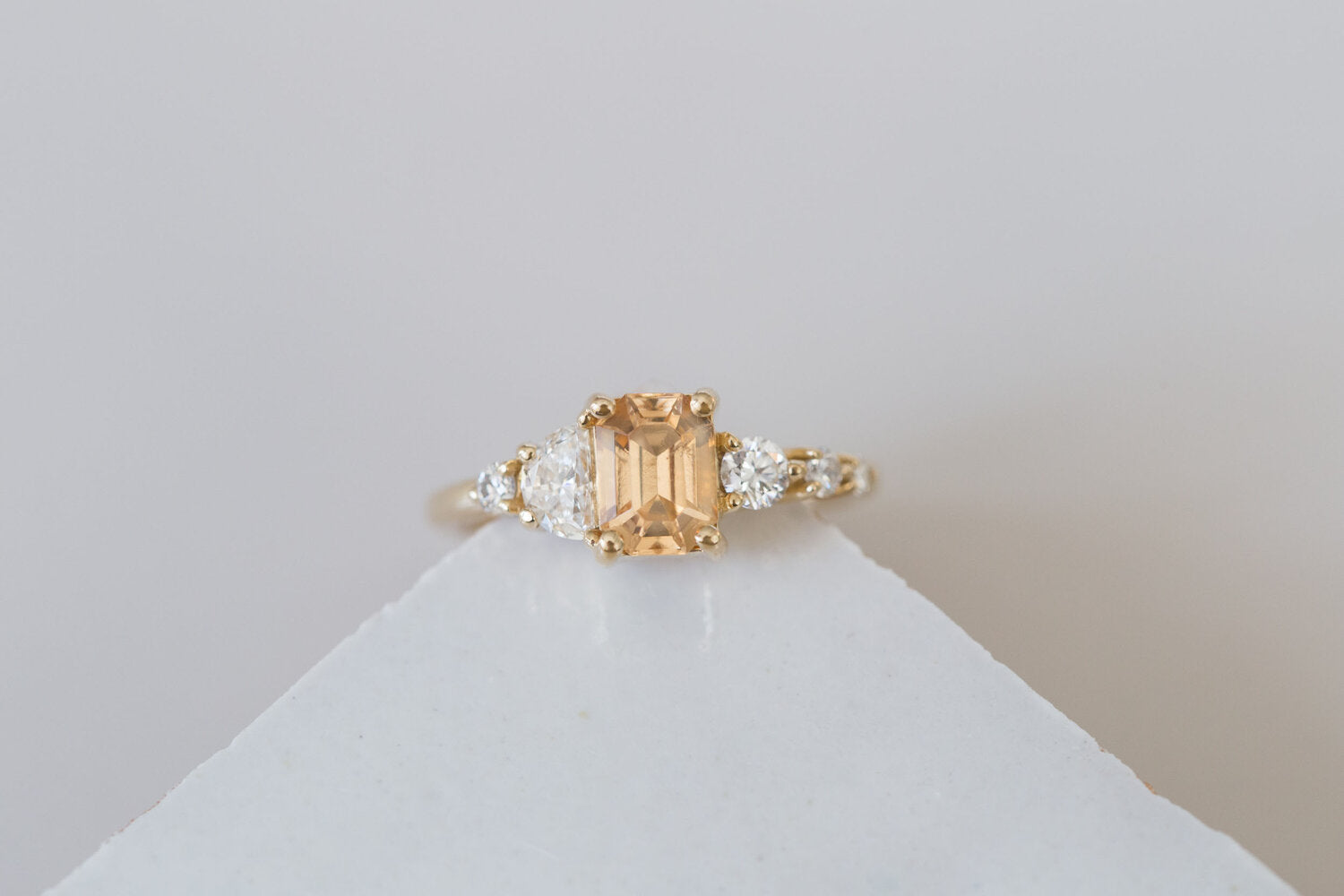 Sarine Ring | Apricot Sapphire + Half Moon Diamond + Diamond Cluster Engagement Ring | 14k Recycled Gold | One of a Kind