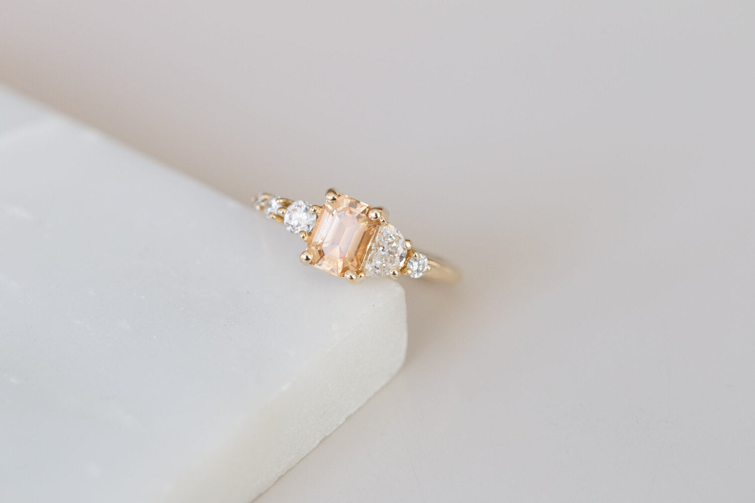 Sarine Ring | Apricot Sapphire + Half Moon Diamond + Diamond Cluster Engagement Ring | 14k Recycled Gold | One of a Kind