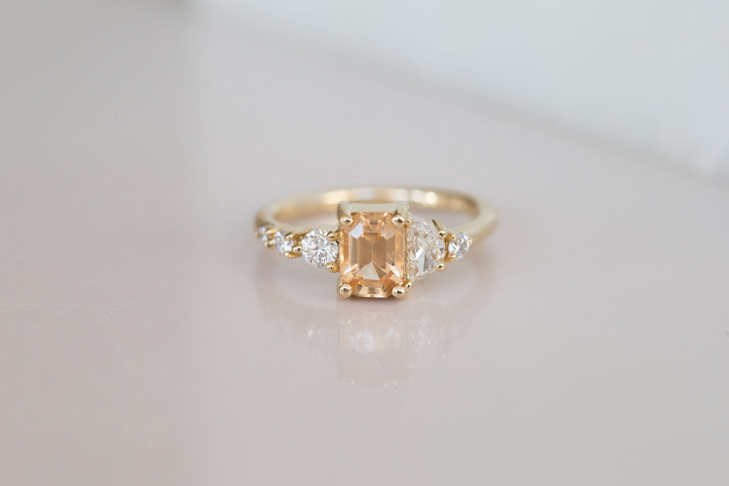 Sarine Ring | Apricot Sapphire + Half Moon Diamond + Diamond Cluster Engagement Ring | 14k Recycled Gold | One of a Kind