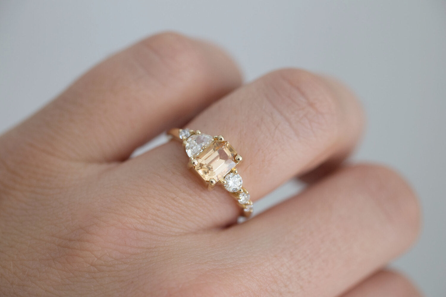 Sarine Ring | Apricot Sapphire + Half Moon Diamond + Diamond Cluster Engagement Ring | 14k Recycled Gold | One of a Kind