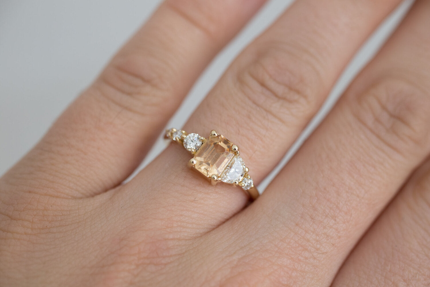 Sarine Ring | Apricot Sapphire + Half Moon Diamond + Diamond Cluster Engagement Ring | 14k Recycled Gold | One of a Kind