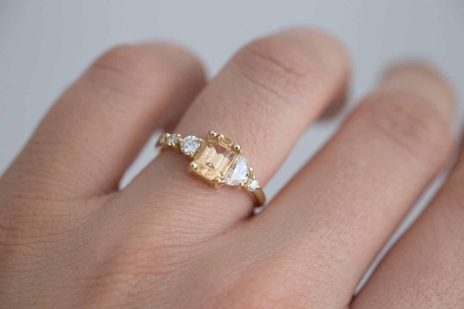 Sarine Ring | Apricot Sapphire + Half Moon Diamond + Diamond Cluster Engagement Ring | 14k Recycled Gold | One of a Kind