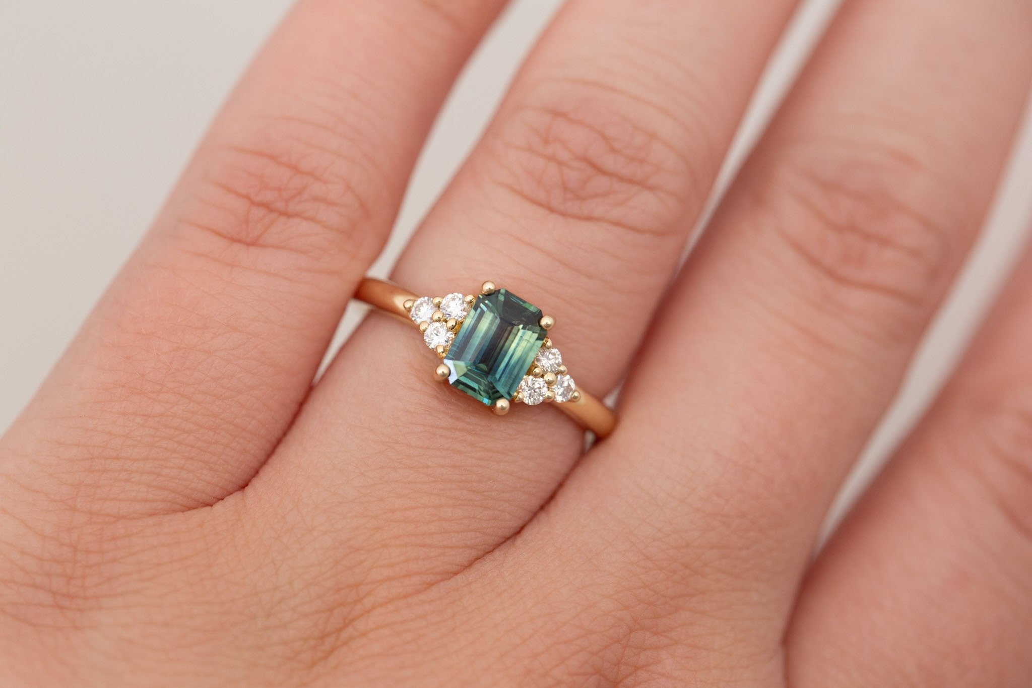 Verona Ring | Bicolor Green Emerald Cut Sapphire + Round Diamond Accents Engagement Ring 1.16 ct | 14k Recycled Gold | One of a Kind