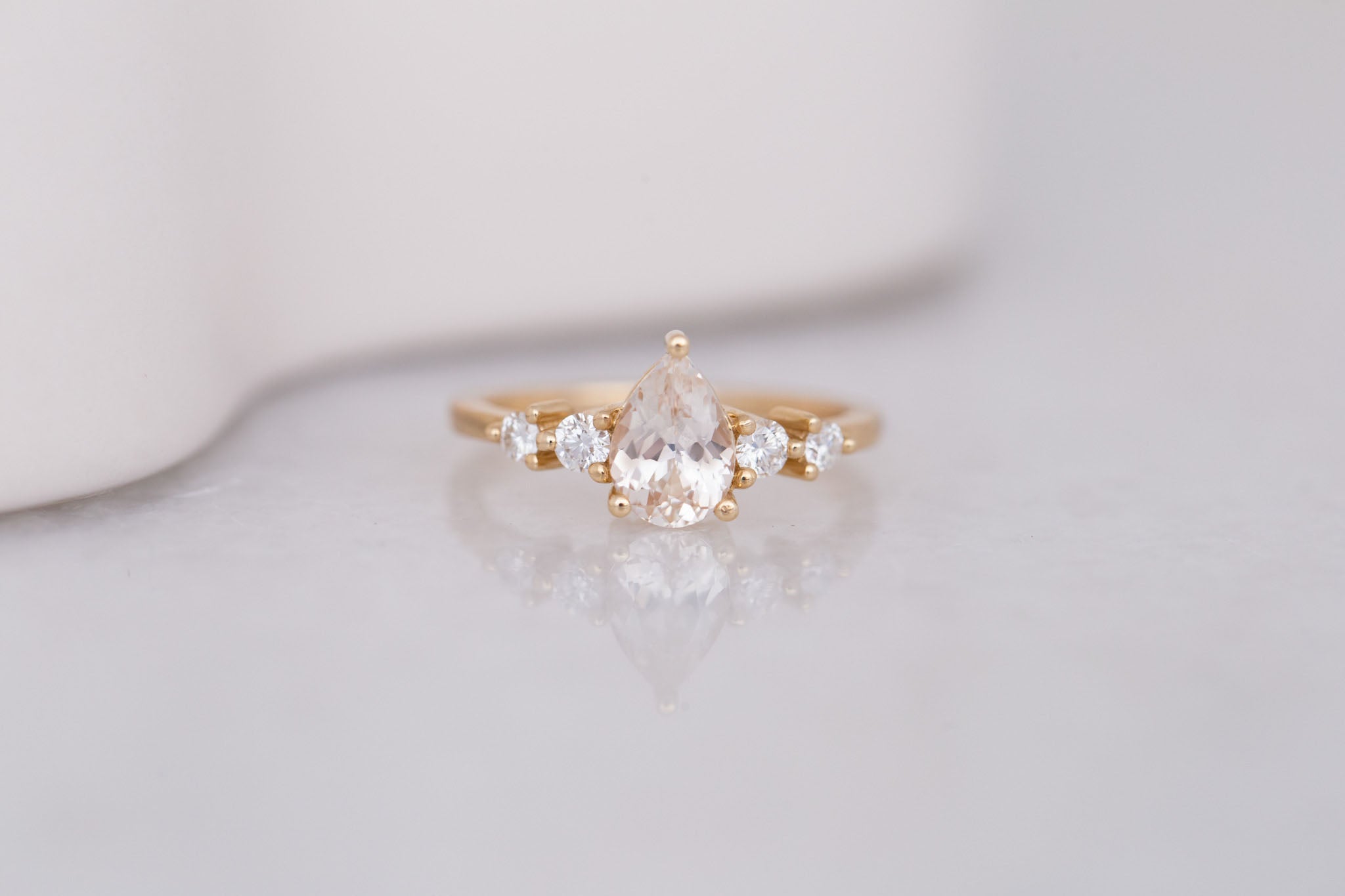 Arbor Ring | Icy Blush Pear Sapphire + Round Diamond Accent Engagement Ring 1.24 ct | 14k Recycled Gold | One of a Kind