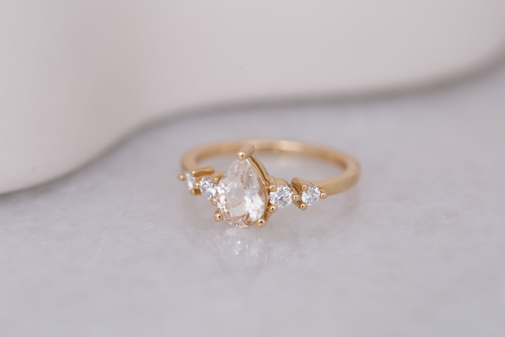 Arbor Ring | Icy Blush Pear Sapphire + Round Diamond Accent Engagement Ring 1.24 ct | 14k Recycled Gold | One of a Kind
