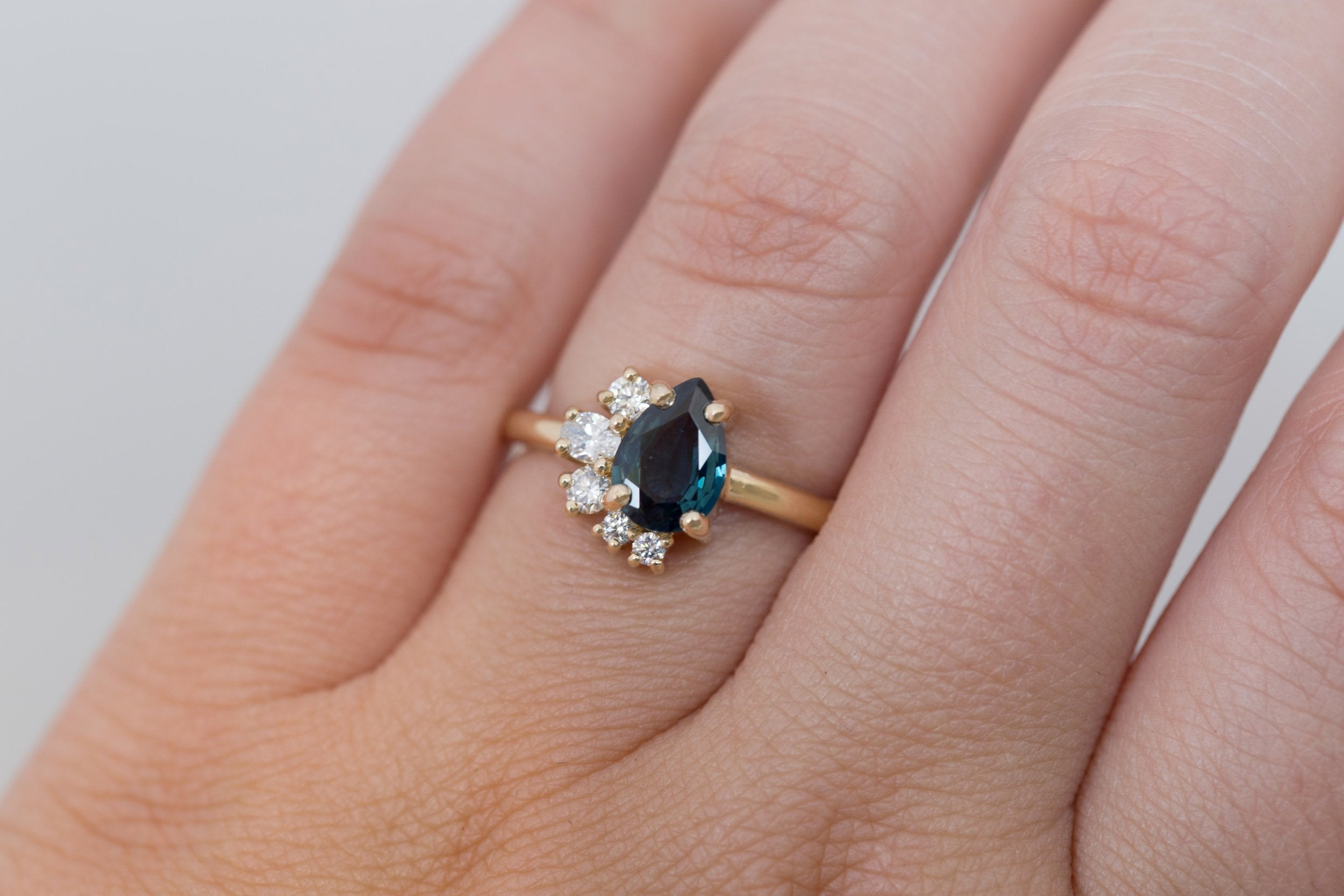 Evaline Ring | Teal Pear Cut Sapphire + Asymmetrical Diamond Cluster Engagement Ring 1.27 ct | 14k Recycled Gold | One of a Kind