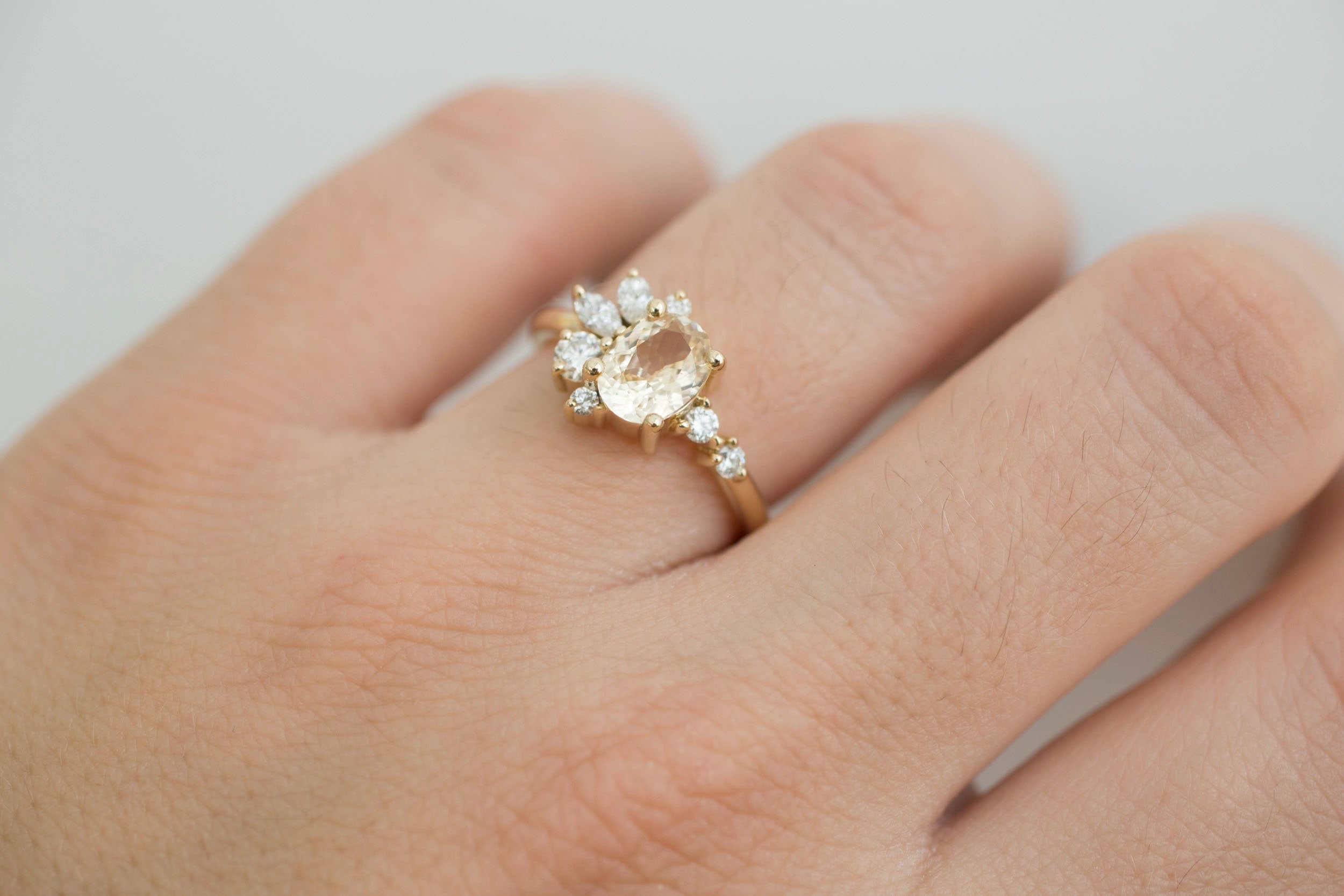 Ambretta Ring | Apricot Oval Sapphire + Diamond Cluster Engagement Ring 1.36 ct | 14k Recycled Gold | One of a Kind