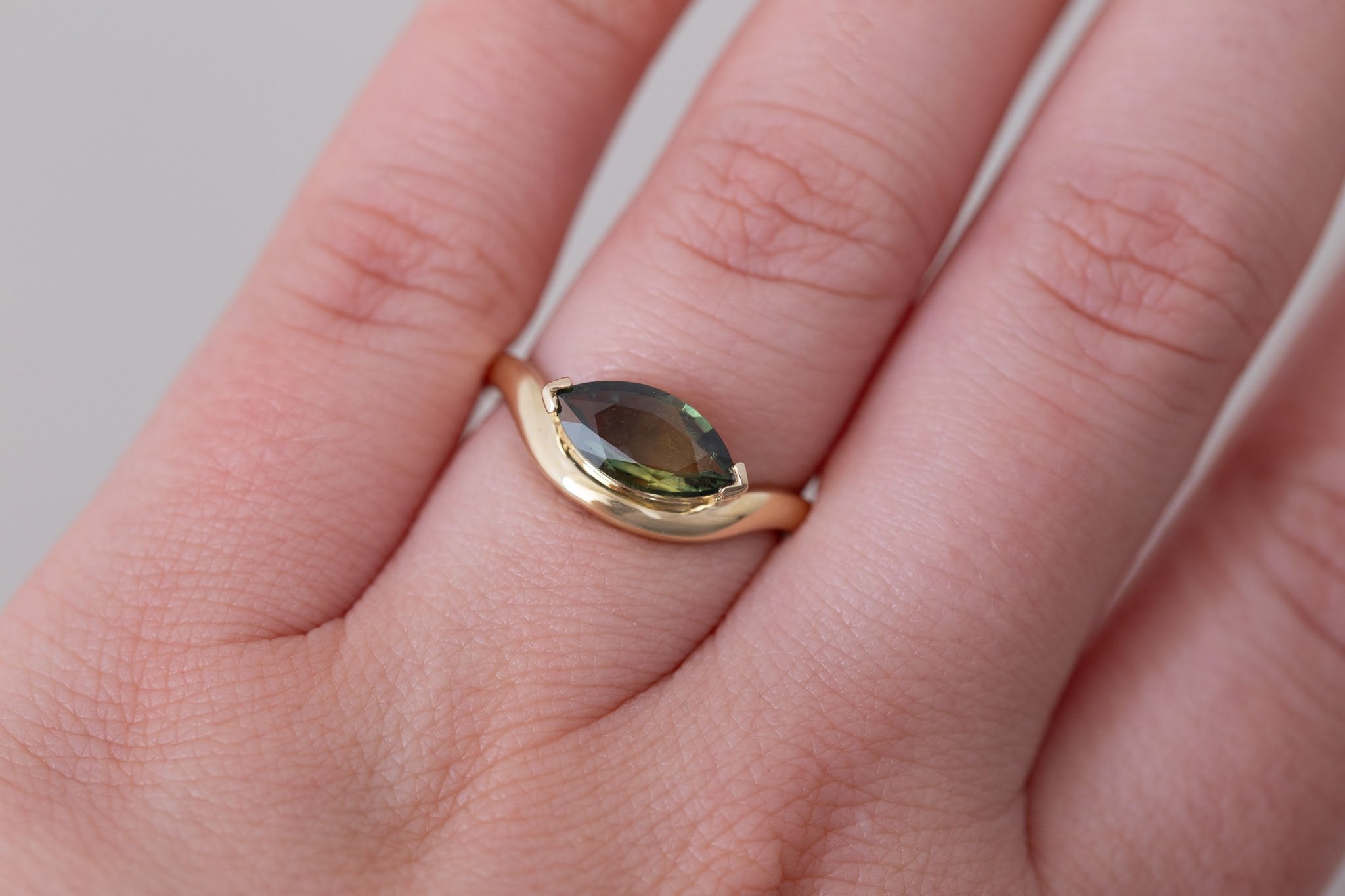 Rhodes Ring | Olive Green Marquise Sapphire Solitaire + Curved Band Engagement Ring 1.42 ct | 14k Recycled Gold | One of a Kind