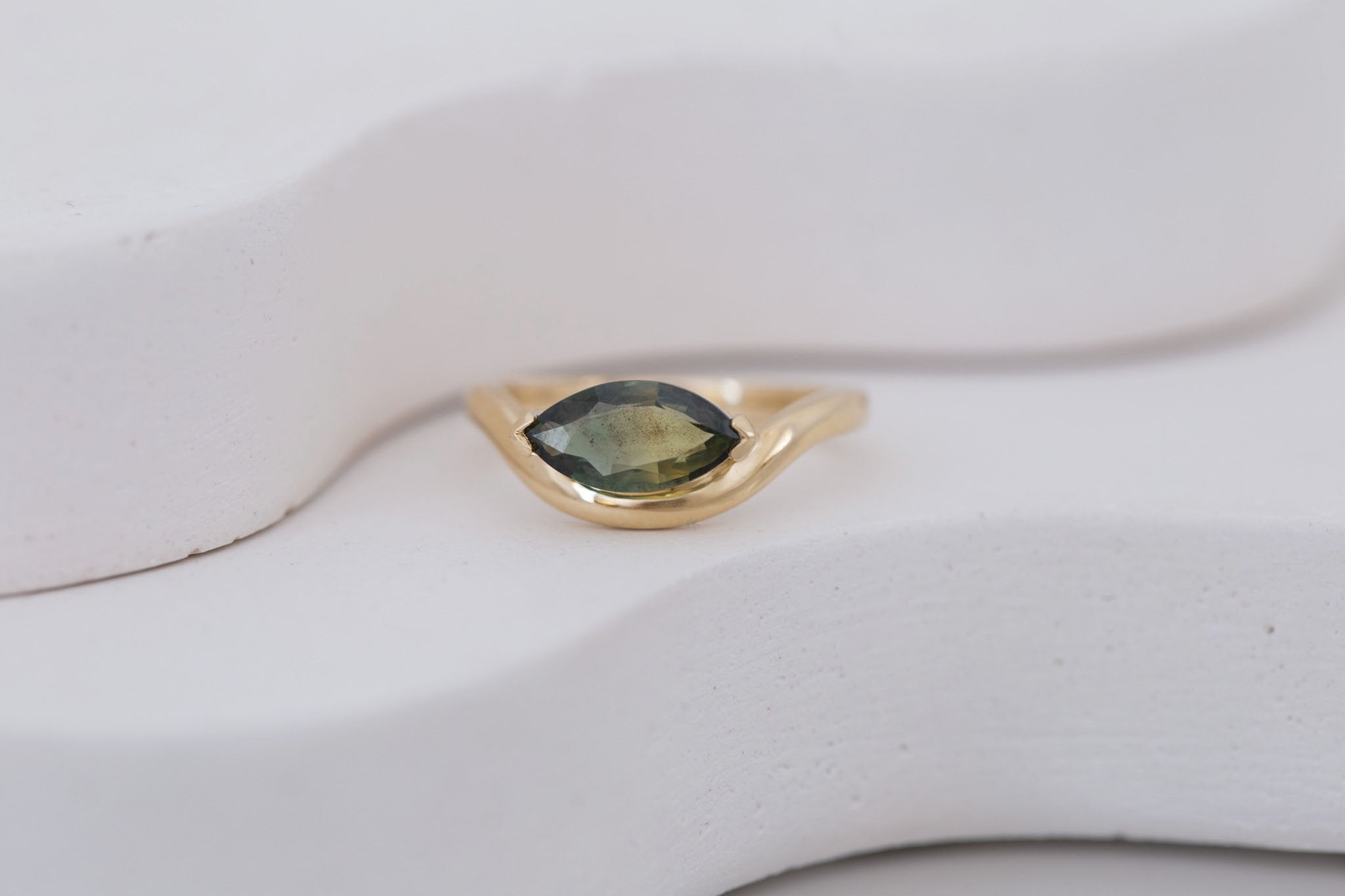 Rhodes Ring | Olive Green Marquise Sapphire Solitaire + Curved Band Engagement Ring 1.42 ct | 14k Recycled Gold | One of a Kind
