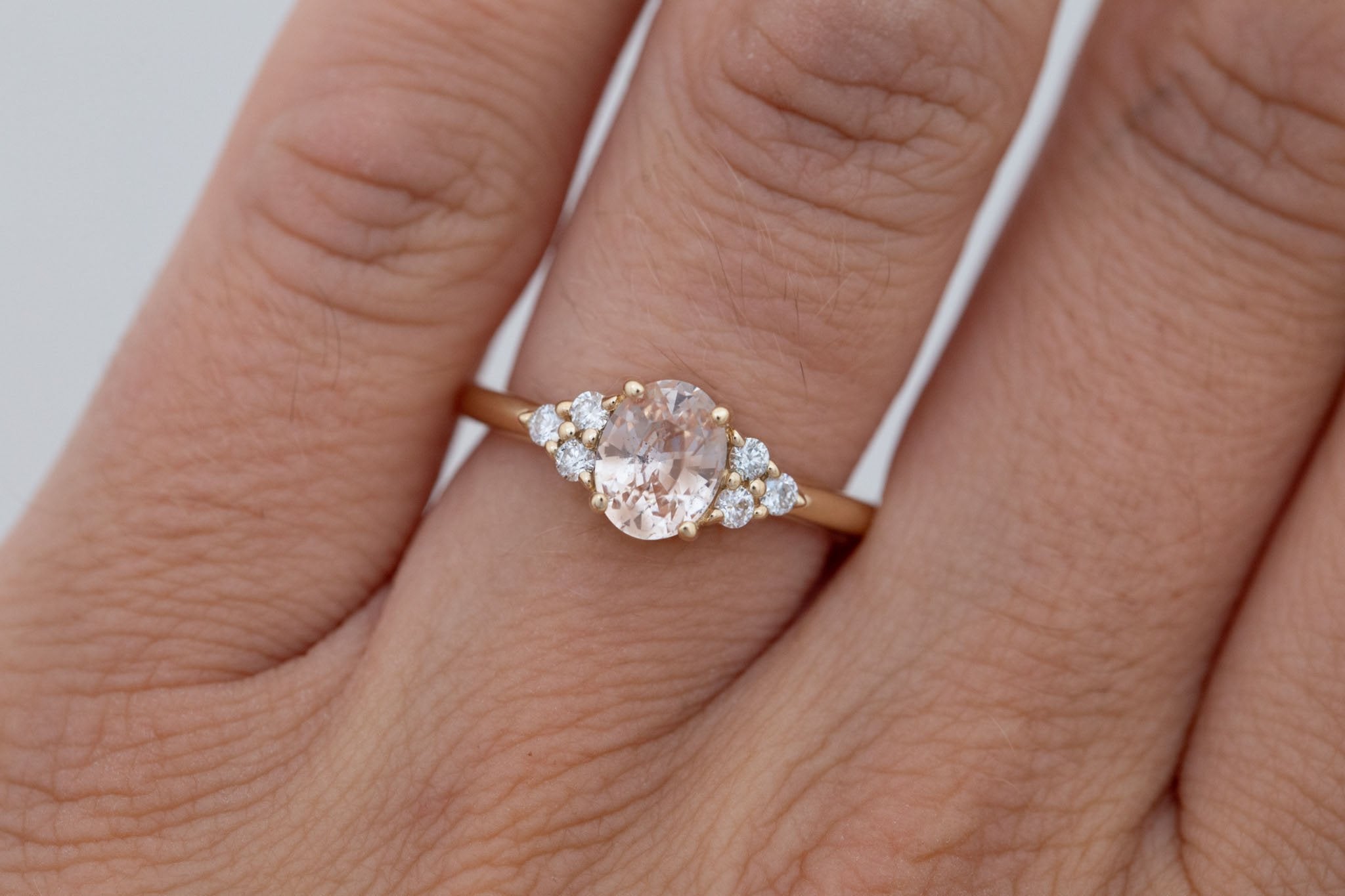 Verona Ring | Peach Oval Sapphire + Round Diamond Accents Engagement Ring 1.46 ct | 14k Recycled Gold | One of a Kind
