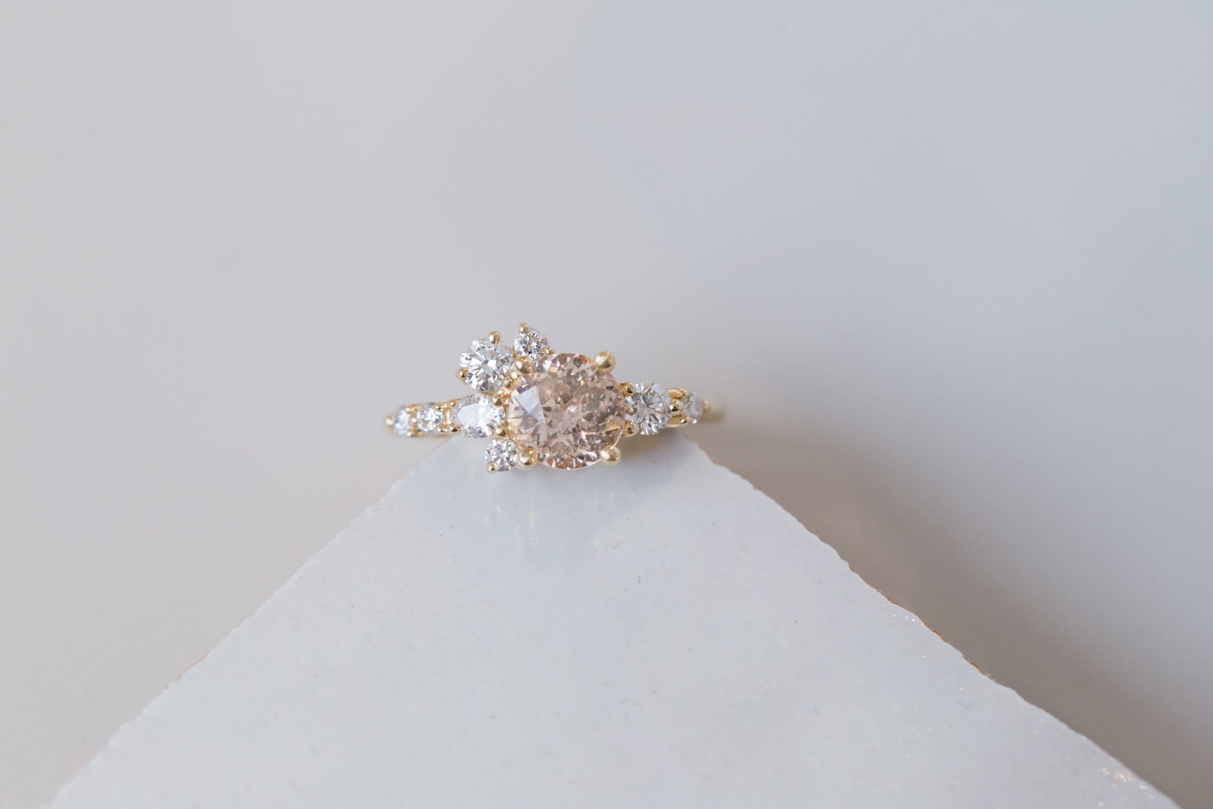 Ilia Ring | Blush Apricot Round Sapphire + Diamond Cluster Engagement Ring | 14k Recycled Gold | One of a Kind