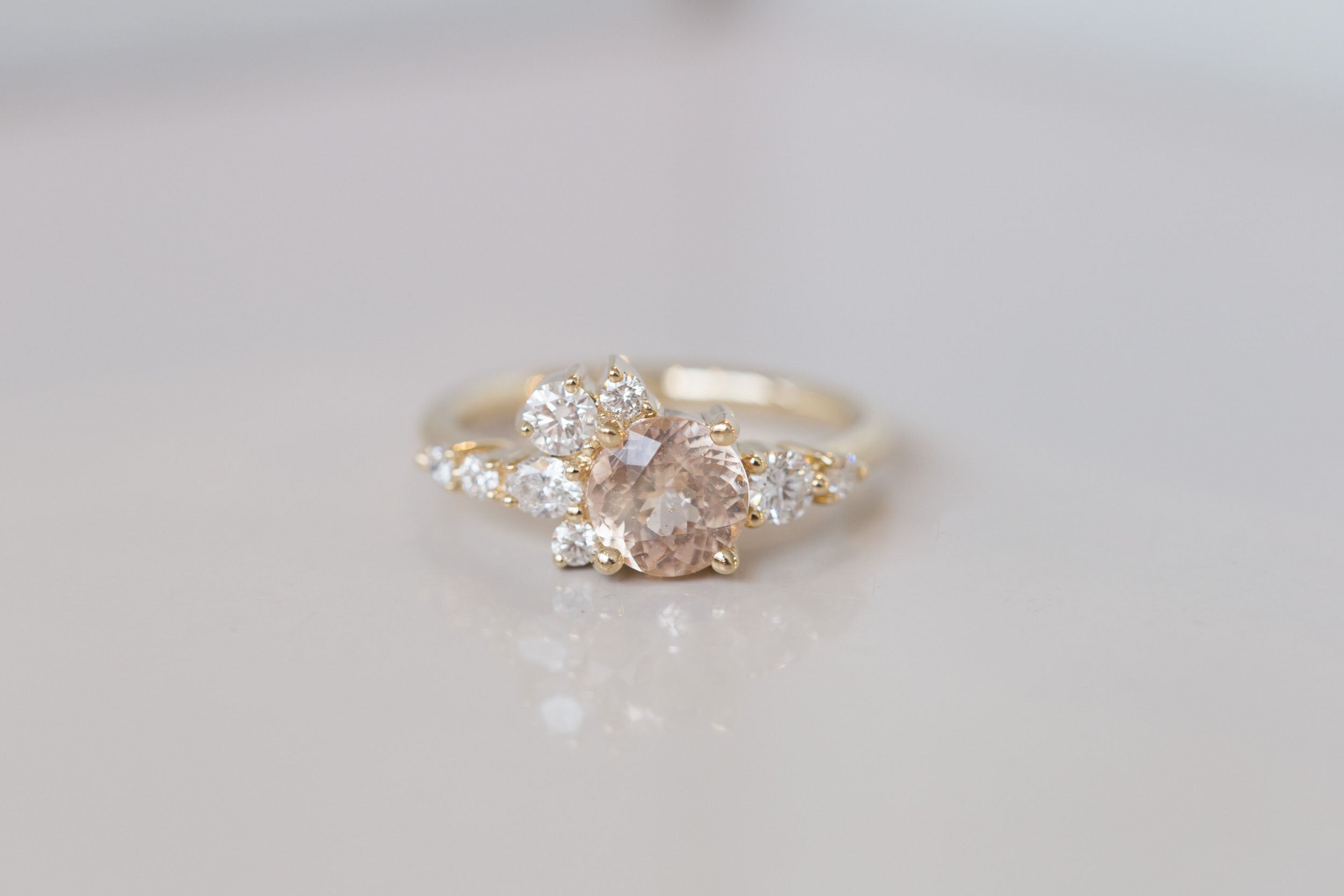Ilia Ring | Blush Apricot Round Sapphire + Diamond Cluster Engagement Ring | 14k Recycled Gold | One of a Kind