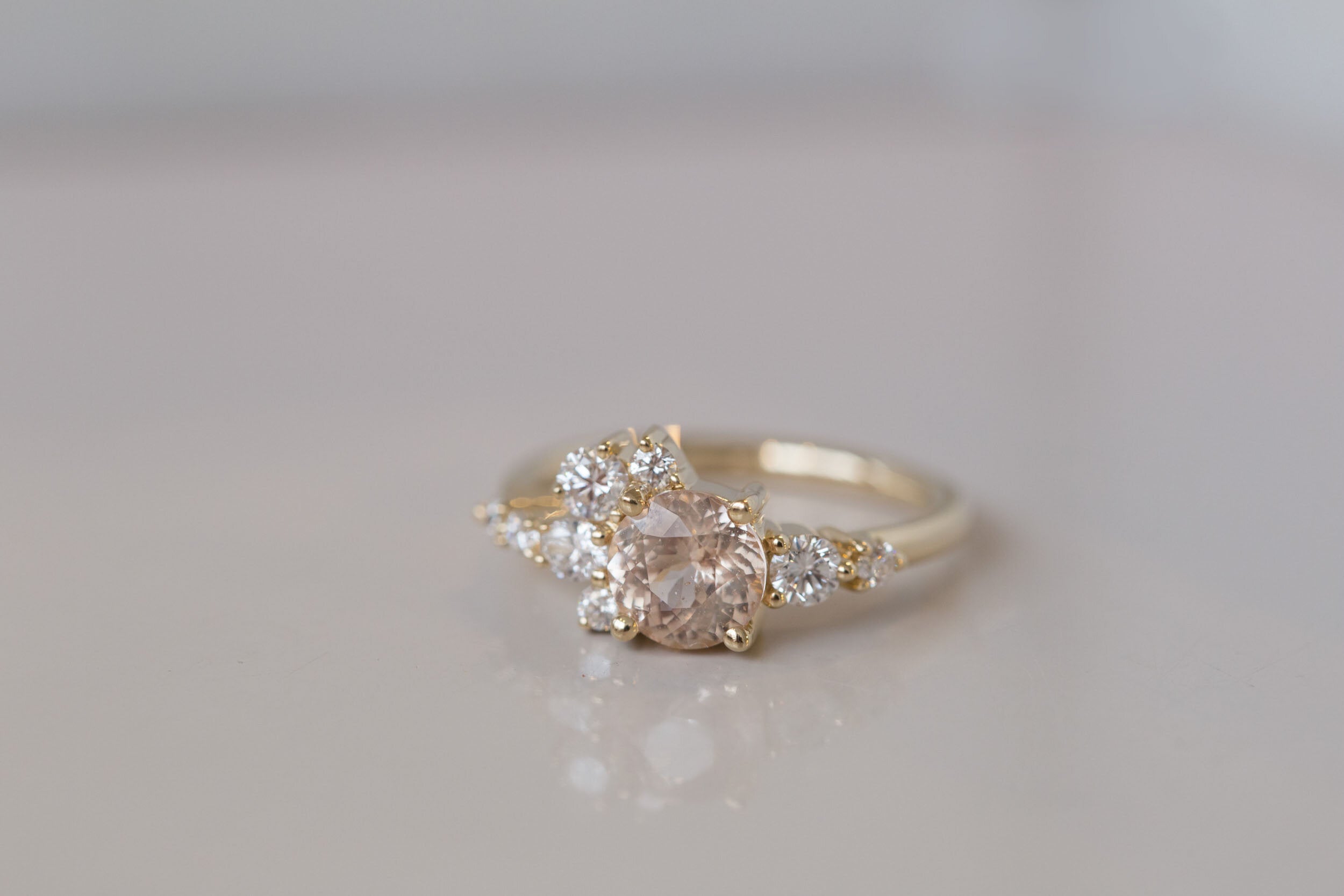Ilia Ring | Blush Apricot Round Sapphire + Diamond Cluster Engagement Ring | 14k Recycled Gold | One of a Kind