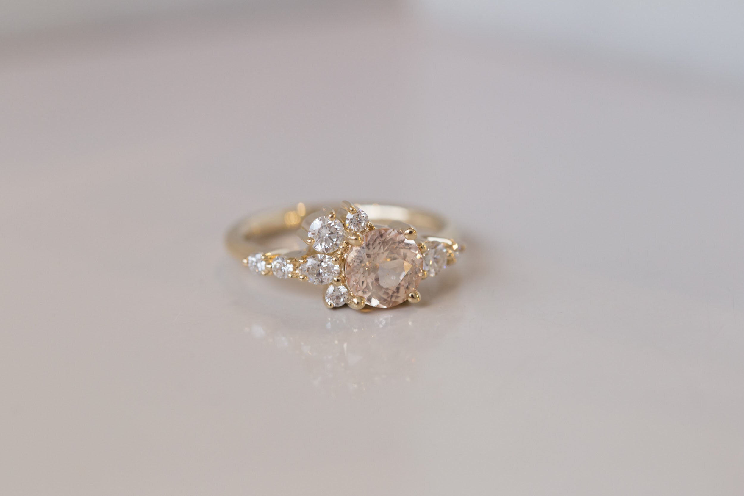 Ilia Ring | Blush Apricot Round Sapphire + Diamond Cluster Engagement Ring | 14k Recycled Gold | One of a Kind