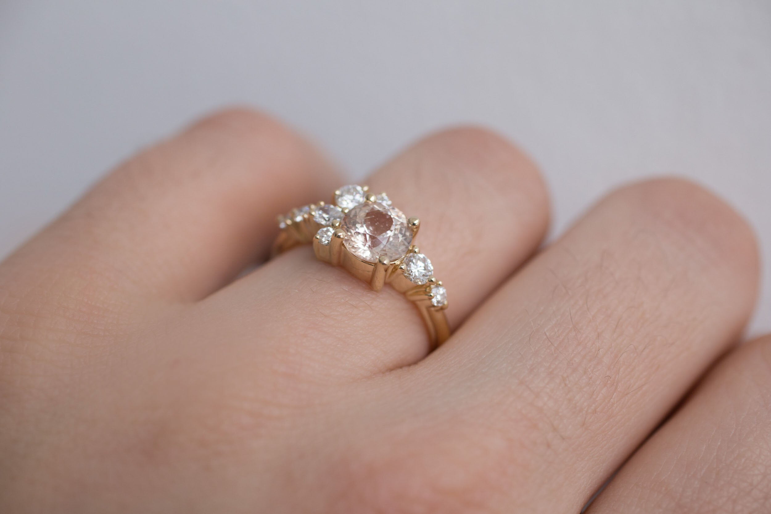 Ilia Ring | Blush Apricot Round Sapphire + Diamond Cluster Engagement Ring | 14k Recycled Gold | One of a Kind