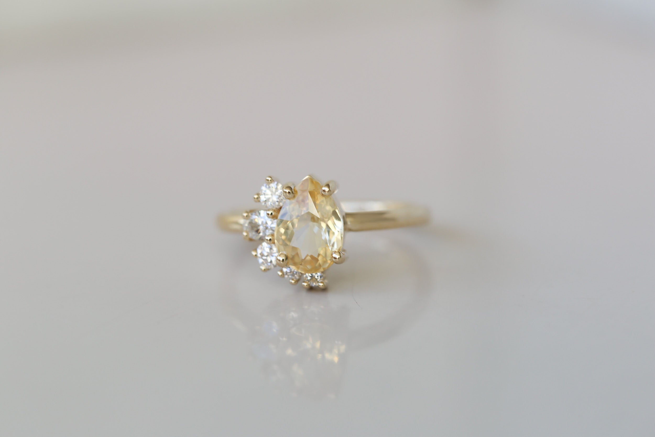 Evaline Ring | Pear Cut Apricot Sapphire + Asymmetrical Diamond Cluster Engagement Ring | 14k Recycled Gold | One of a Kind