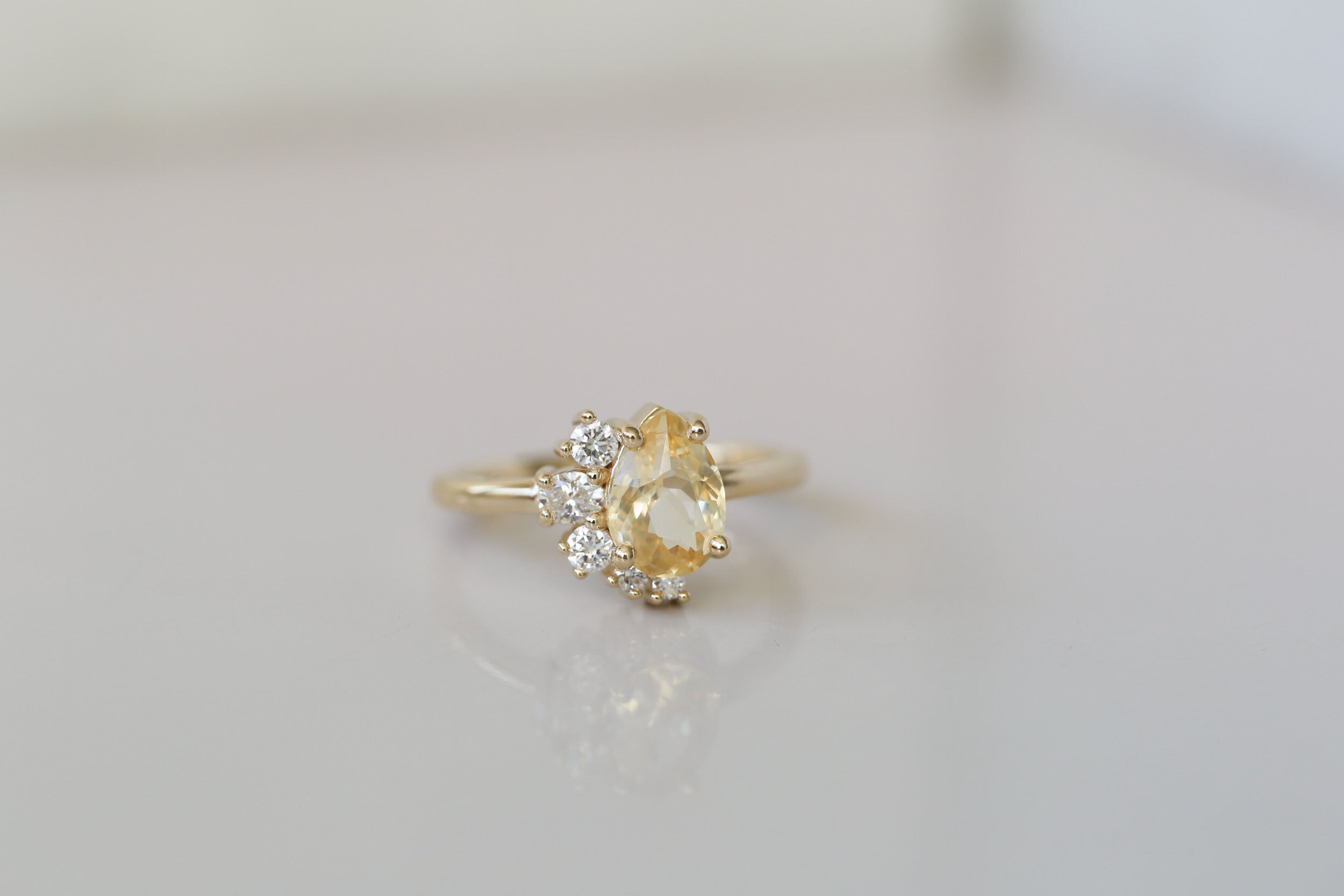Evaline Ring | Pear Cut Apricot Sapphire + Asymmetrical Diamond Cluster Engagement Ring | 14k Recycled Gold | One of a Kind