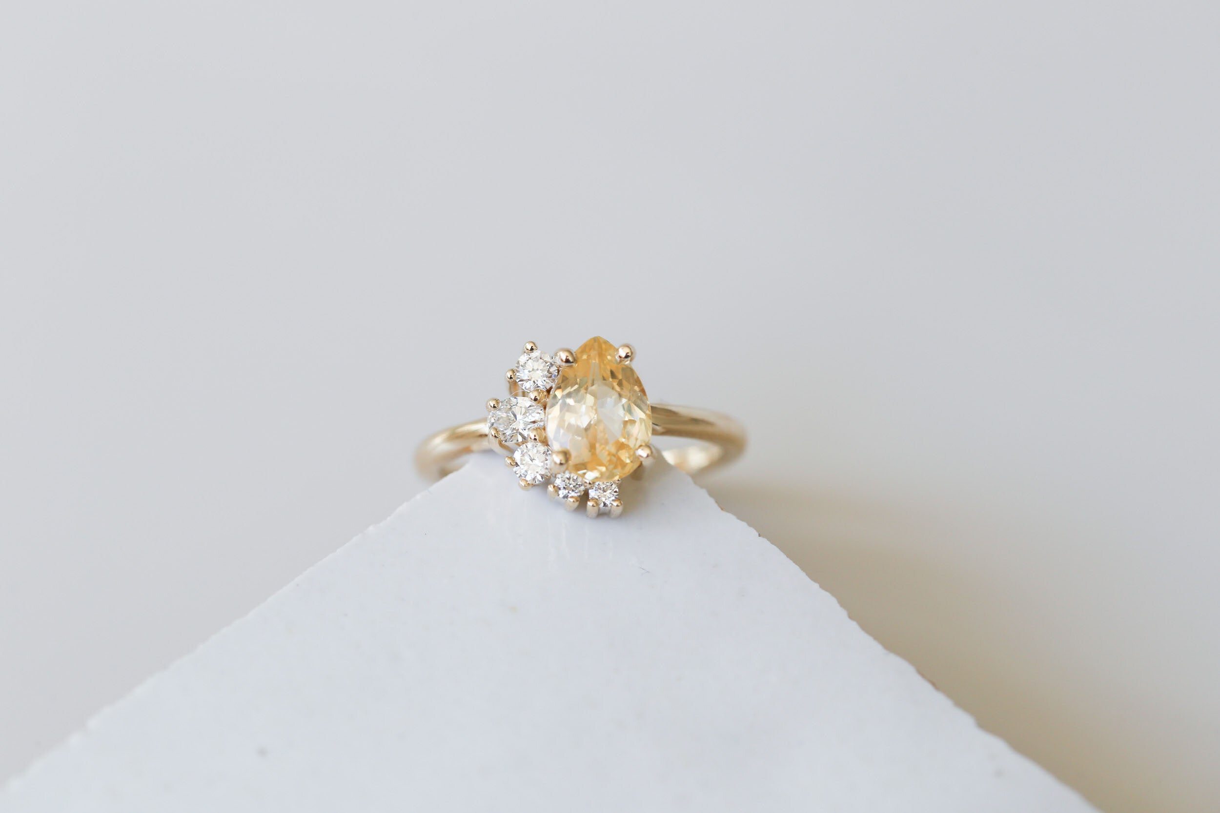 Evaline Ring | Pear Cut Apricot Sapphire + Asymmetrical Diamond Cluster Engagement Ring | 14k Recycled Gold | One of a Kind