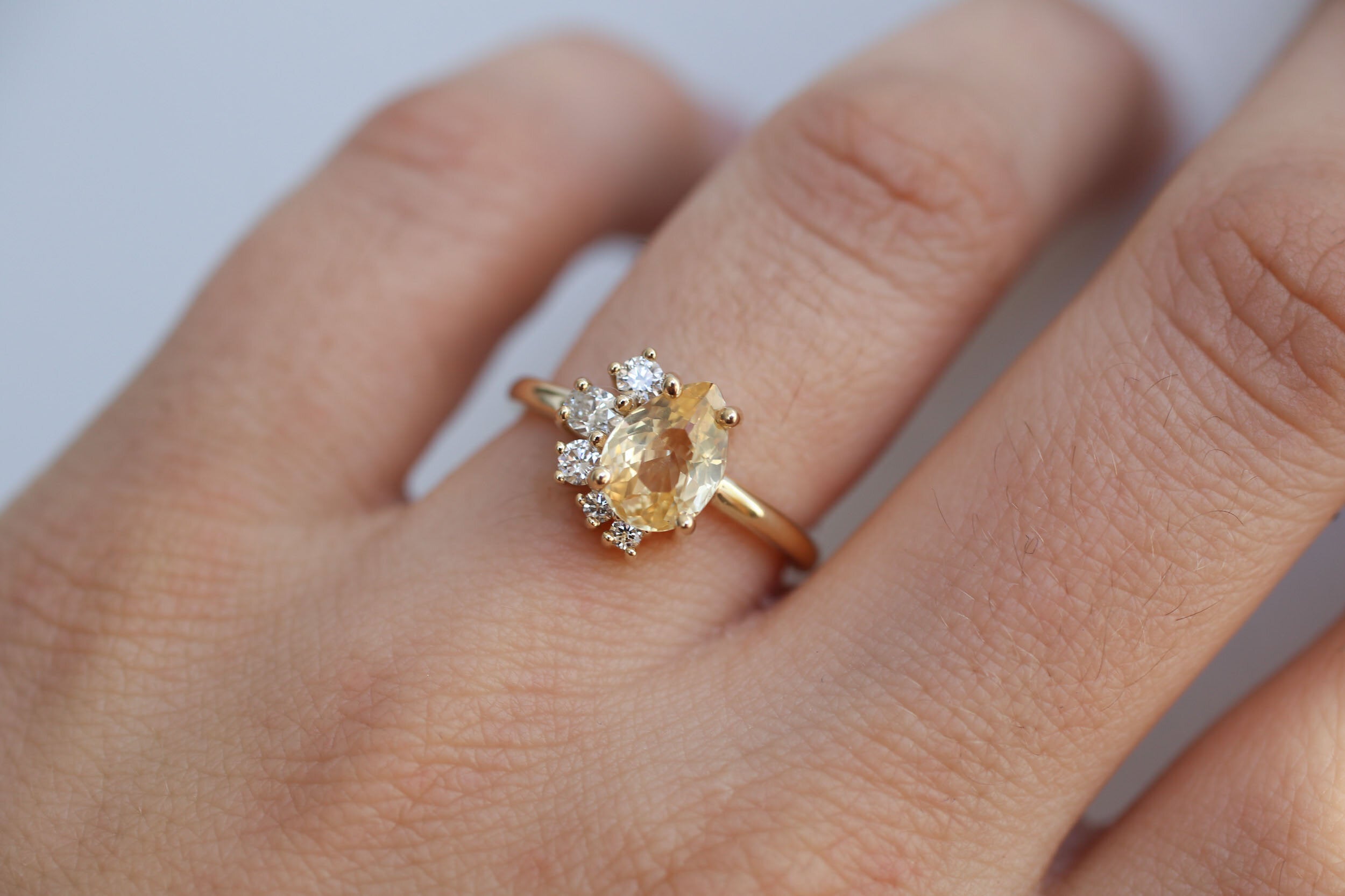 Evaline Ring | Pear Cut Apricot Sapphire + Asymmetrical Diamond Cluster Engagement Ring | 14k Recycled Gold | One of a Kind