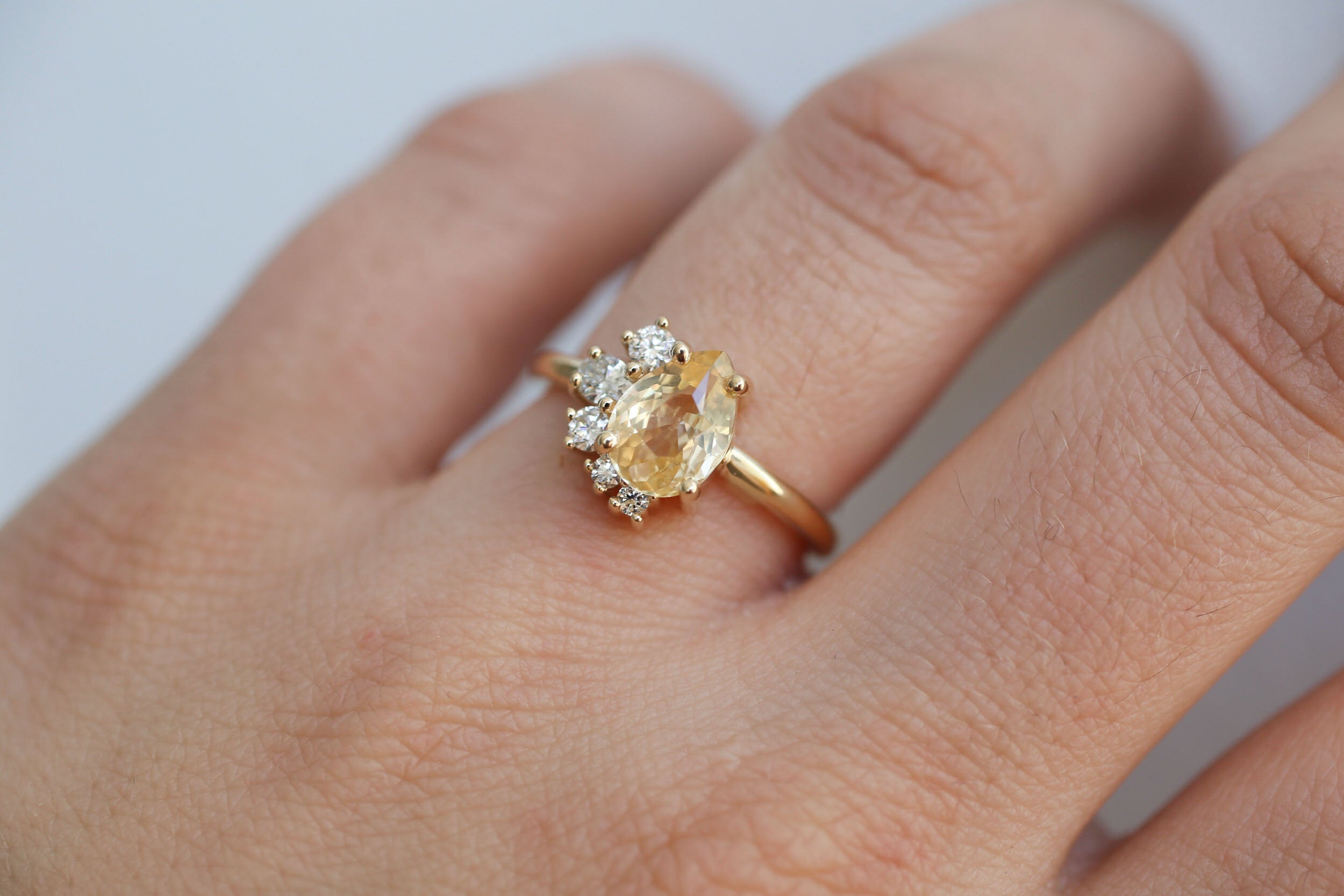 Evaline Ring | Pear Cut Apricot Sapphire + Asymmetrical Diamond Cluster Engagement Ring | 14k Recycled Gold | One of a Kind