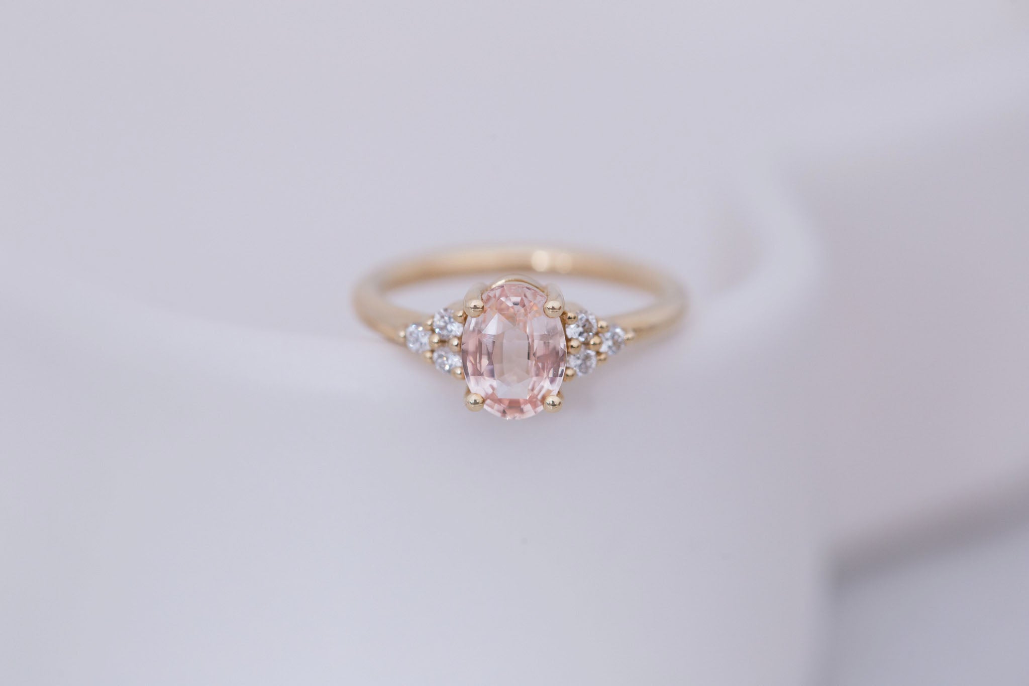 Verona Ring | Peach Oval Sapphire + Round Diamond Accents Engagement Ring 1.68 ct | 14k Recycled Gold | One of a Kind