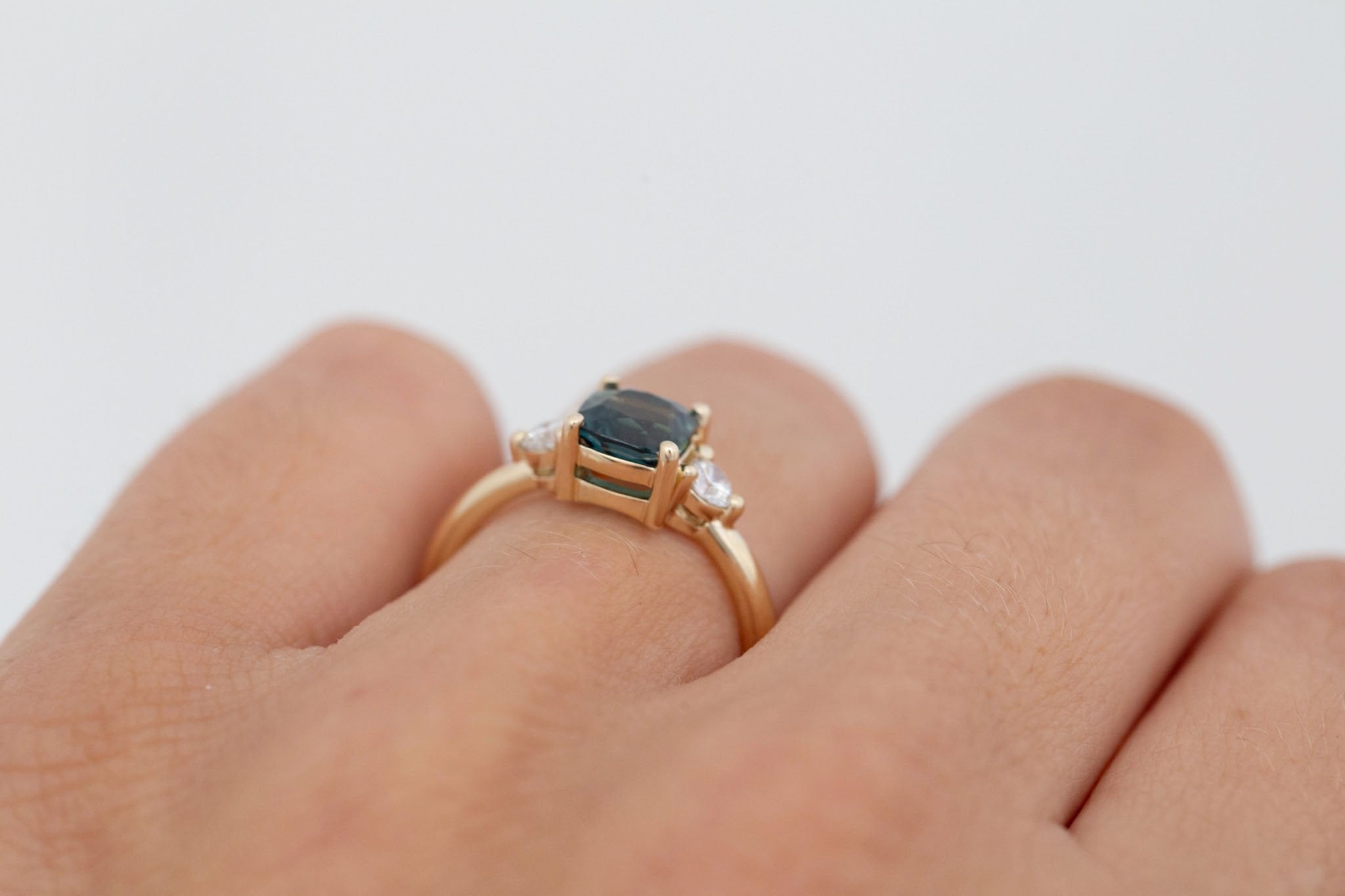 Maeve Ring | Bicolor Teal Cushion Sapphire + Round Diamond Accent Engagement Ring 1.72 ct | 14k Recycled Gold | One of a Kind