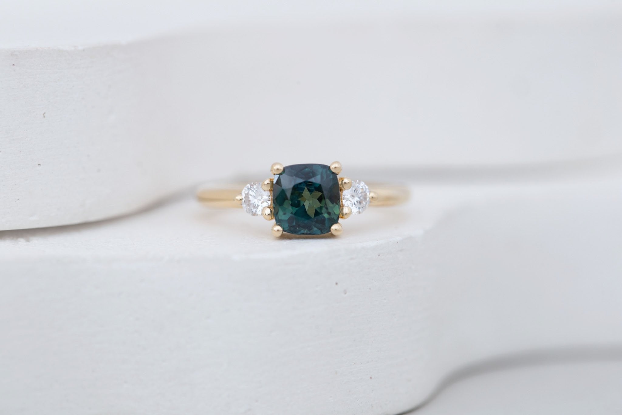 Maeve Ring | Bicolor Teal Cushion Sapphire + Round Diamond Accent Engagement Ring 1.72 ct | 14k Recycled Gold | One of a Kind