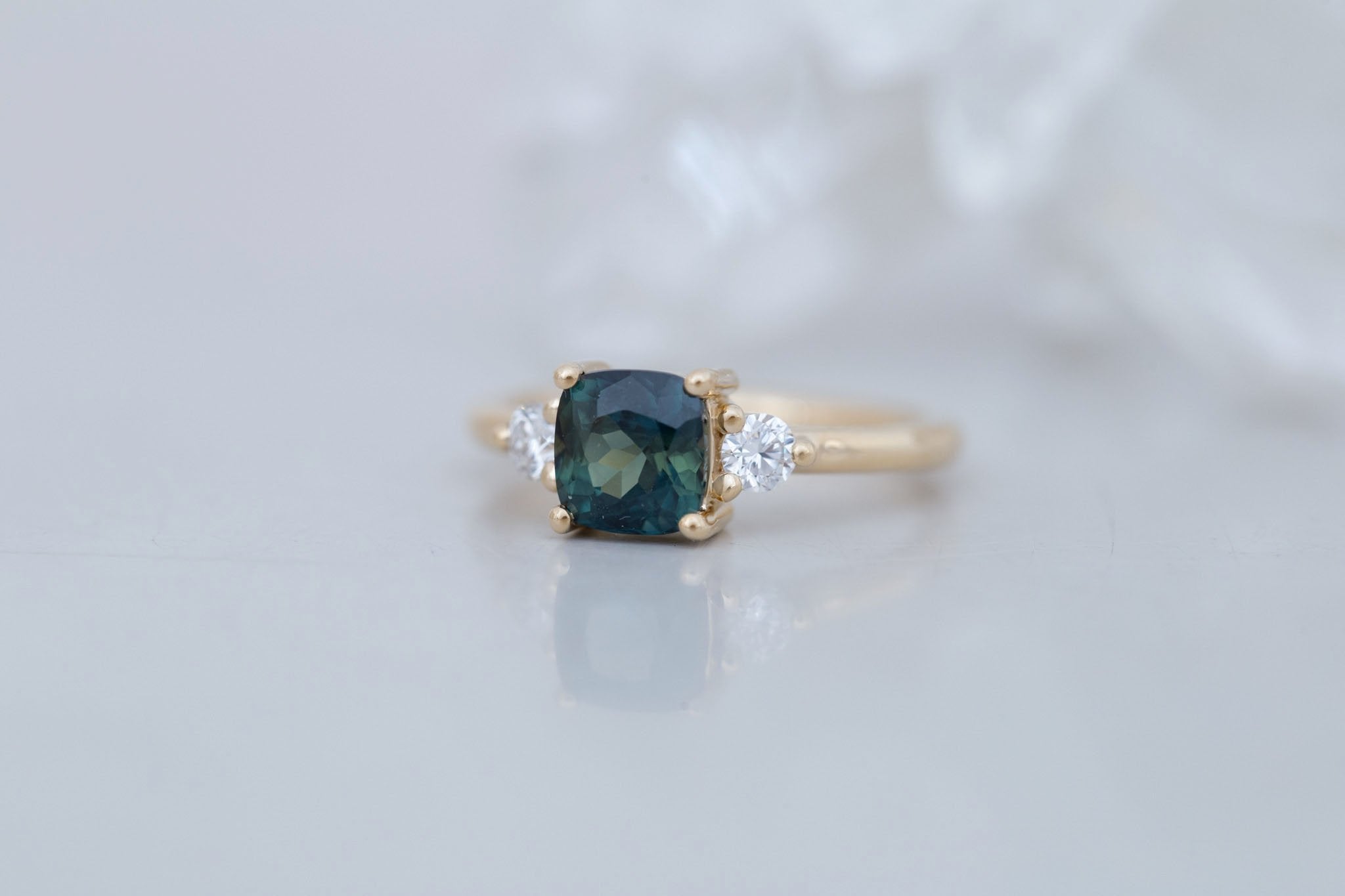 Maeve Ring | Bicolor Teal Cushion Sapphire + Round Diamond Accent Engagement Ring 1.72 ct | 14k Recycled Gold | One of a Kind