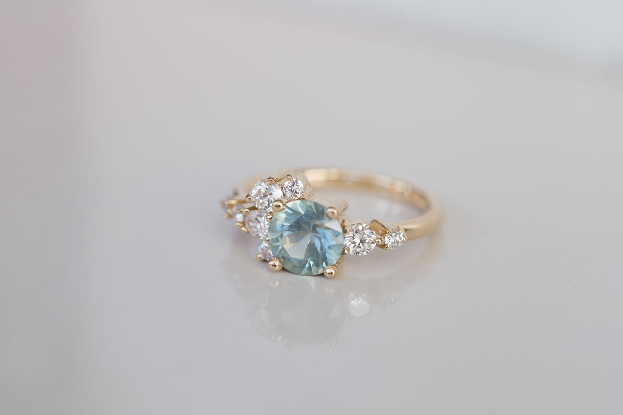 Ilia Ring | Montana Round Sapphire + Diamond Cluster Engagement Ring | 14k Recycled Gold