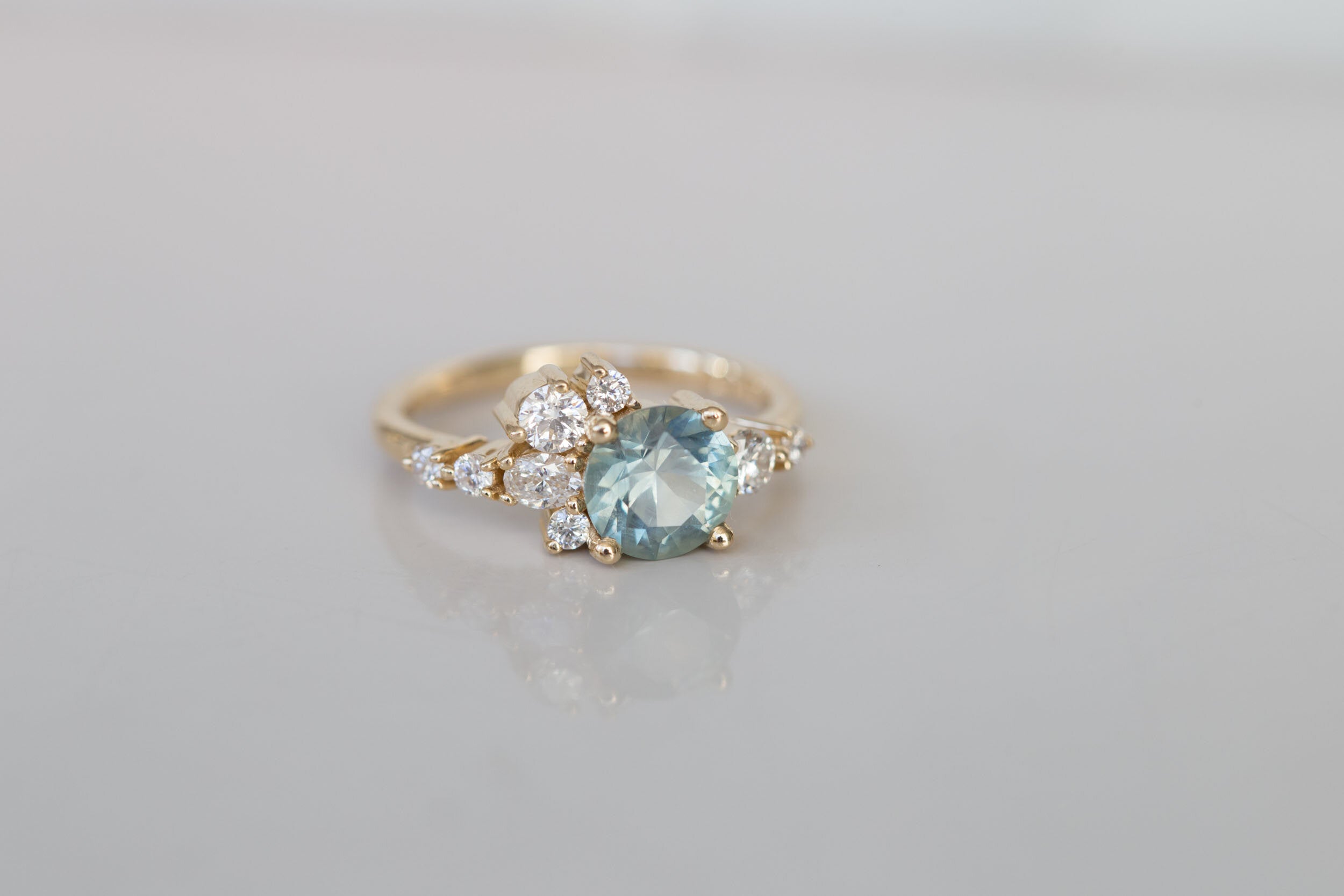 Ilia Ring | Montana Round Sapphire + Diamond Cluster Engagement Ring | 14k Recycled Gold