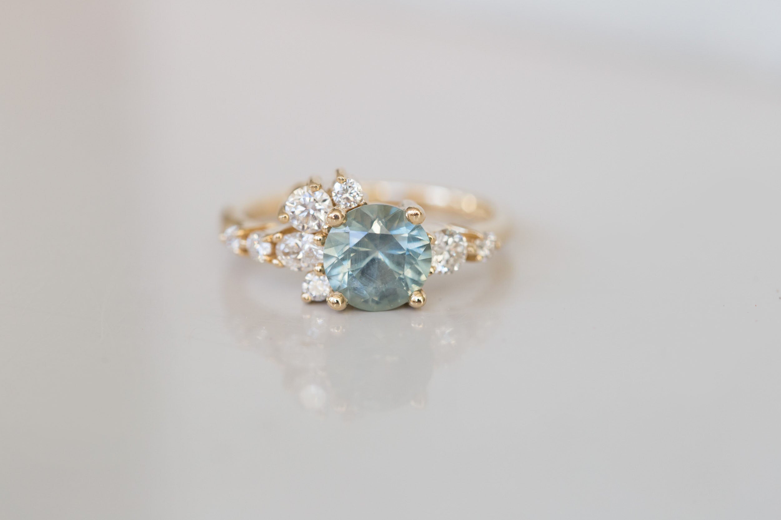 Ilia Ring | Montana Round Sapphire + Diamond Cluster Engagement Ring | 14k Recycled Gold