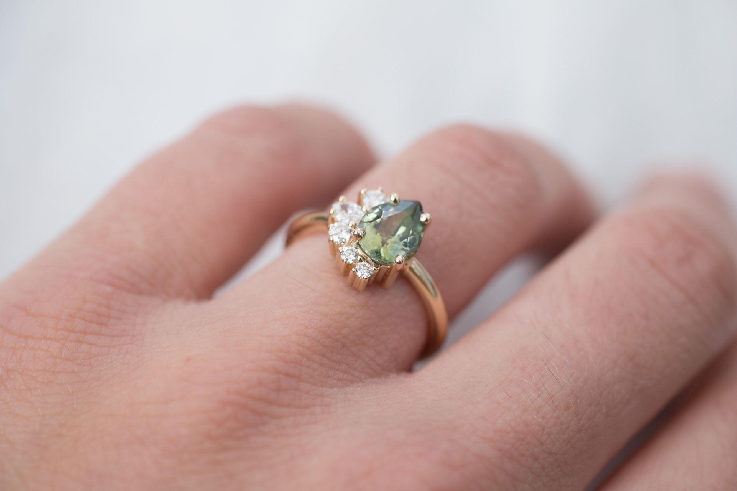 Evaline Ring | Pear Cut Bicolor Green Sapphire + Asymmetrical Diamond Cluster Engagement Ring 1.88 ct | 14k Recycled Gold | One of a Kind