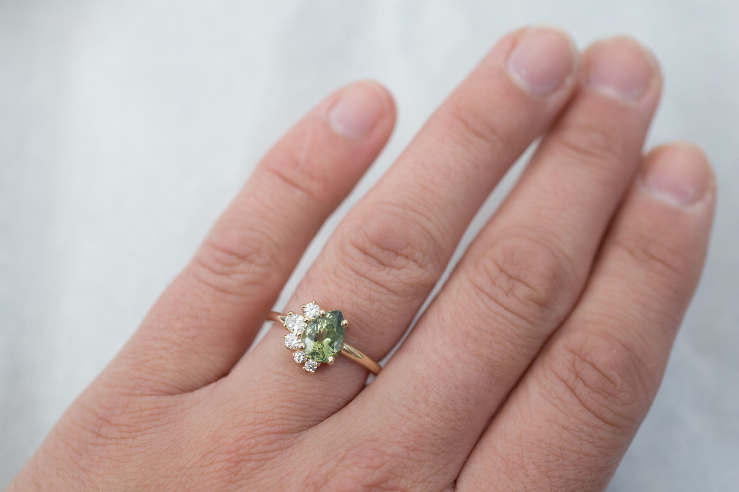 Evaline Ring | Pear Cut Bicolor Green Sapphire + Asymmetrical Diamond Cluster Engagement Ring 1.88 ct | 14k Recycled Gold | One of a Kind