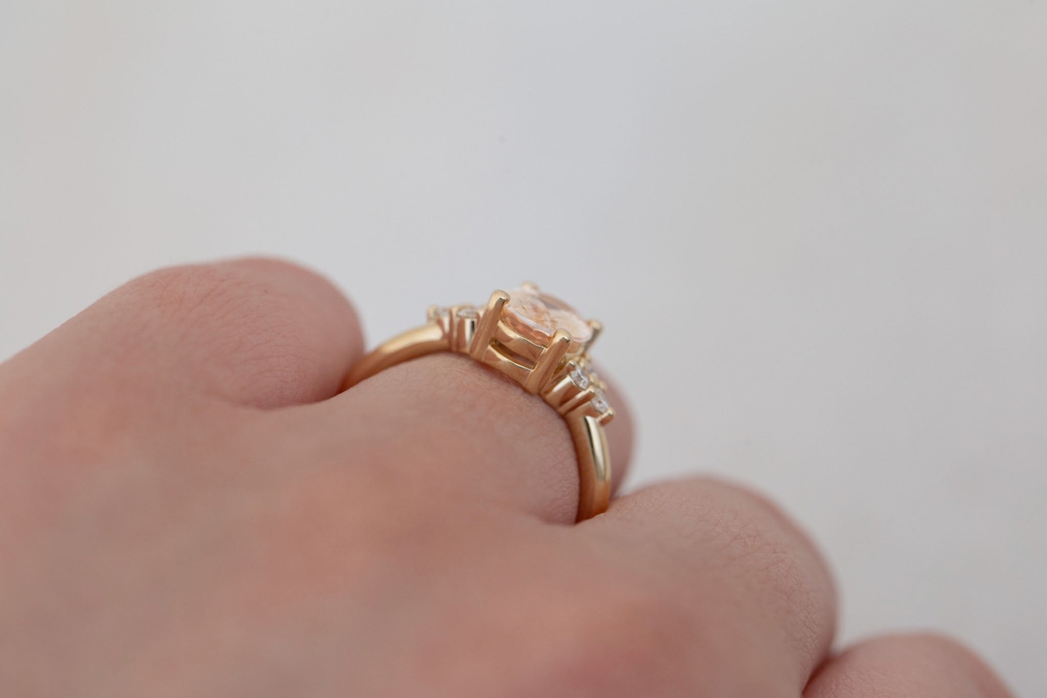 Verona Ring | Peach Oval Sapphire + Round Diamond Accents Engagement Ring 2.05 ct | 14k Recycled Gold | One of a Kind