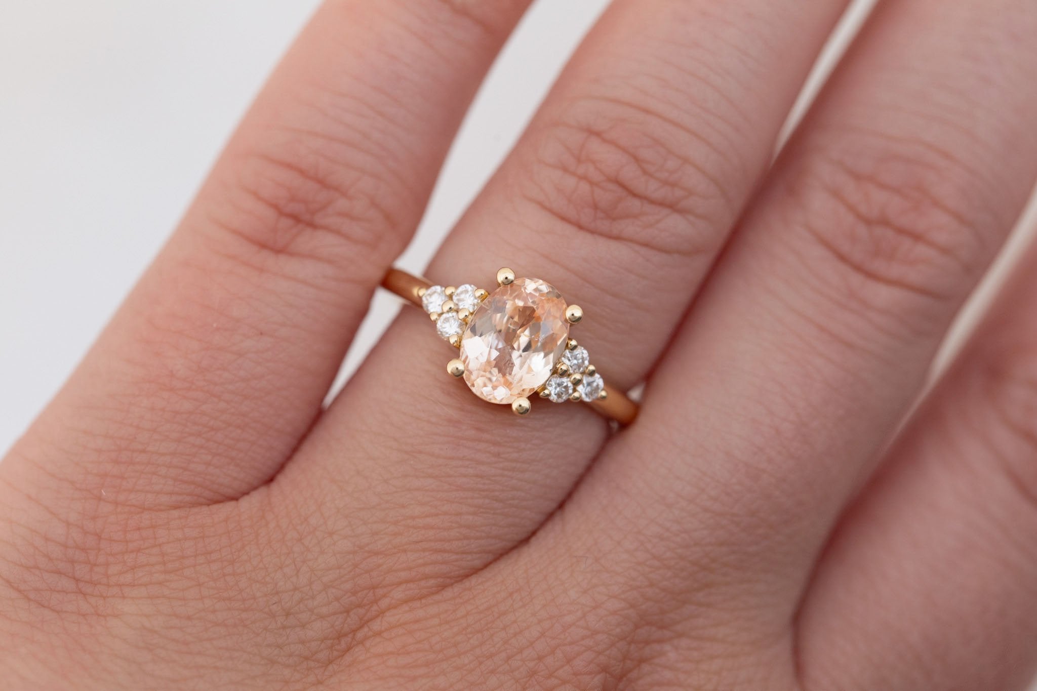 Verona Ring | Peach Oval Sapphire + Round Diamond Accents Engagement Ring 2.05 ct | 14k Recycled Gold | One of a Kind