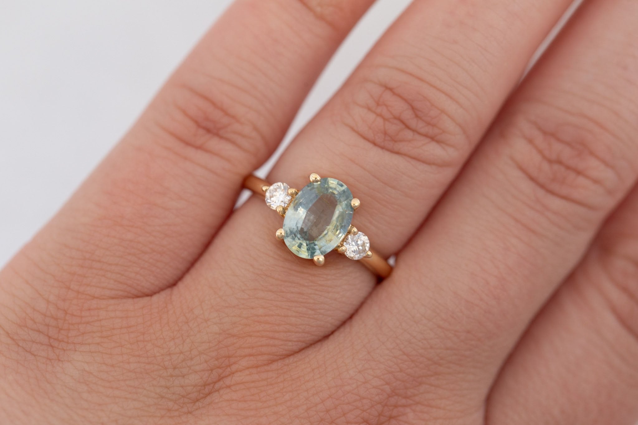 Maeve Ring | Mint Green Oval Sapphire + Round Diamond Accent Engagement Ring 2.21 ct | 14k Recycled Gold | One of a Kind