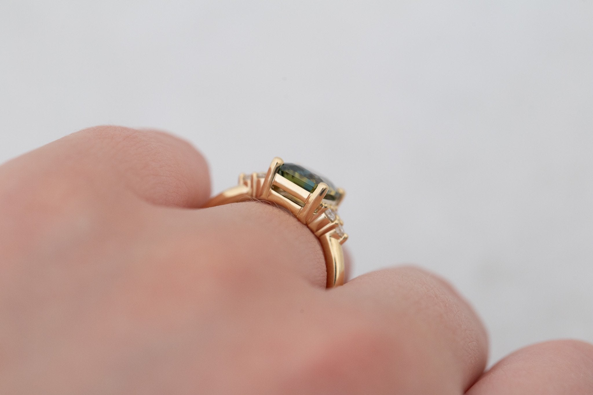 Verona Ring | Green Bicolor Radiant Cut Sapphire + Round Diamond Accents Engagement Ring 2.41 ct | 14k Recycled Gold | One of a Kind