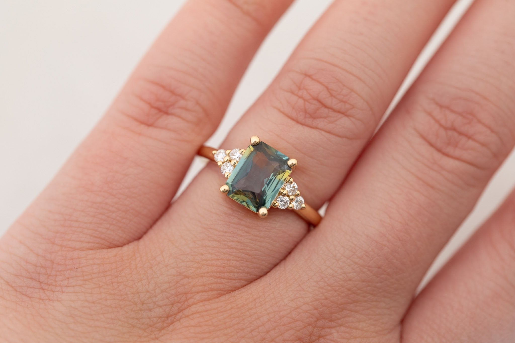 Verona Ring | Green Bicolor Radiant Cut Sapphire + Round Diamond Accents Engagement Ring 2.41 ct | 14k Recycled Gold | One of a Kind