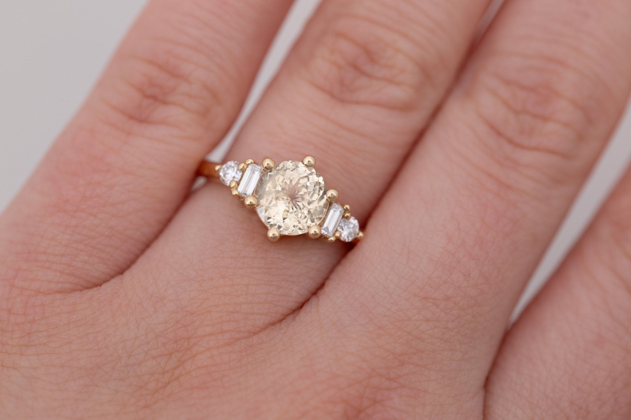 Alsea Ring | Apricot Sapphire + Baguette and Round Diamond Accent Engagement Ring 2.02 ct | 14k Recycled Gold | One of a Kind