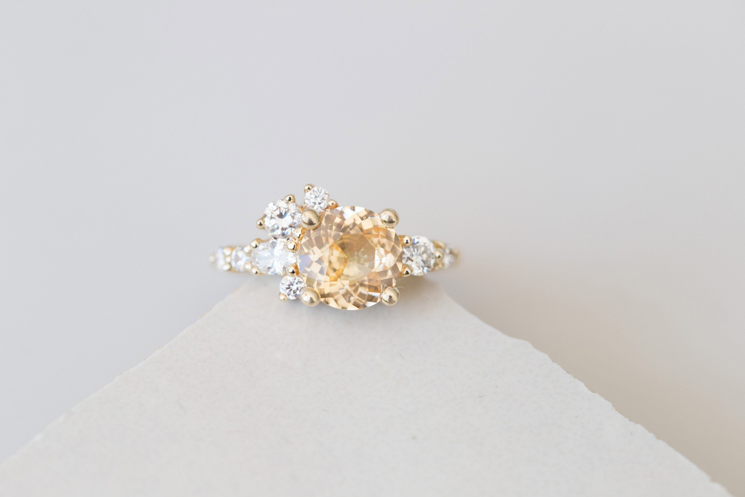 Ilia Ring | Round Apricot Sapphire + Diamond Cluster Engagement Ring 2.05 ct | 14k Recycled Gold | One of a Kind