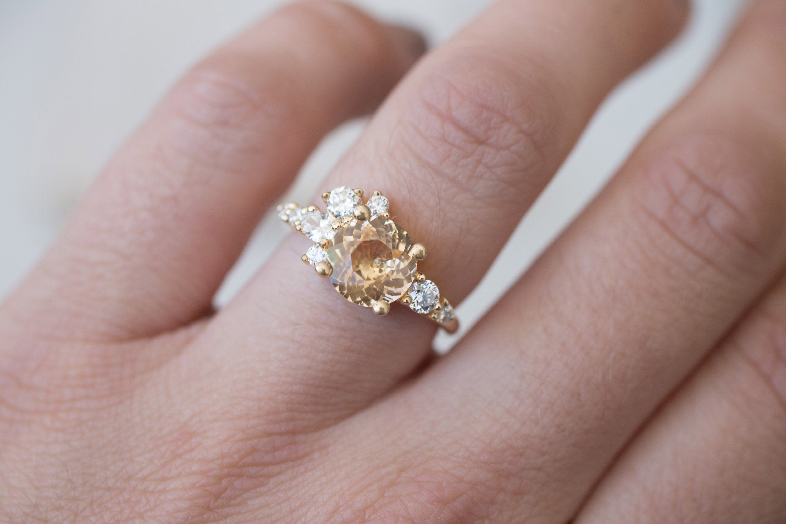 Ilia Ring | Round Apricot Sapphire + Diamond Cluster Engagement Ring 2.05 ct | 14k Recycled Gold | One of a Kind