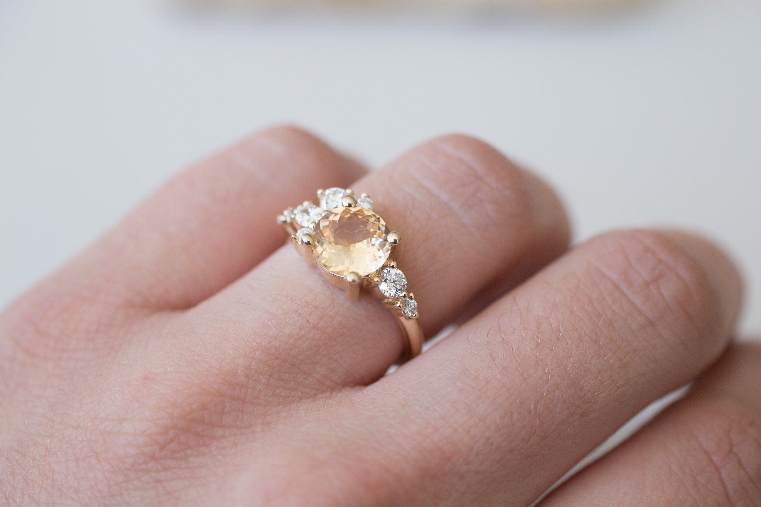 Ilia Ring | Round Apricot Sapphire + Diamond Cluster Engagement Ring 2.05 ct | 14k Recycled Gold | One of a Kind
